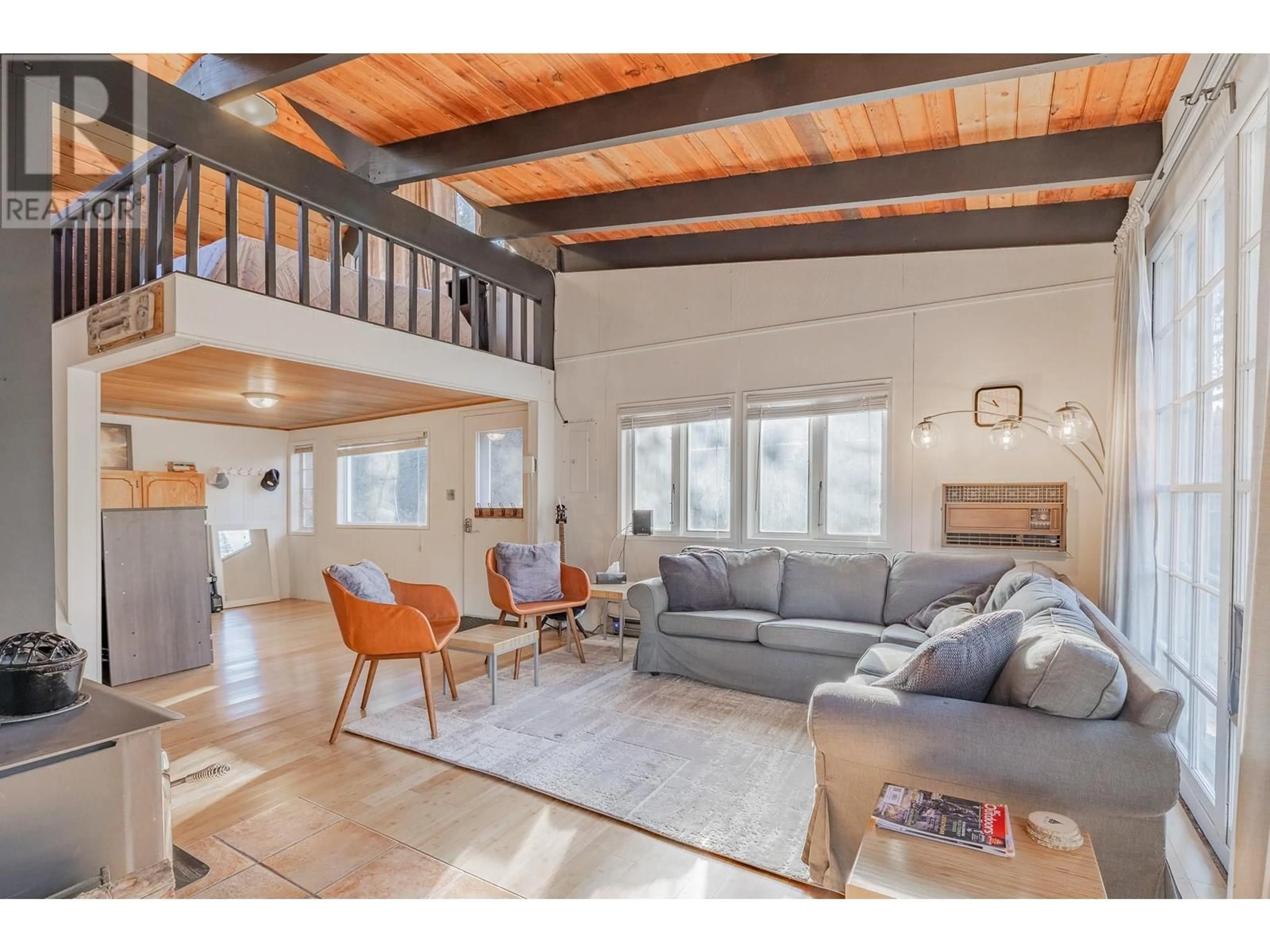 Living room with furniture, wood/laminate floor for 4736 COPPER CRESCENT, Windermere British Columbia V0B2L2