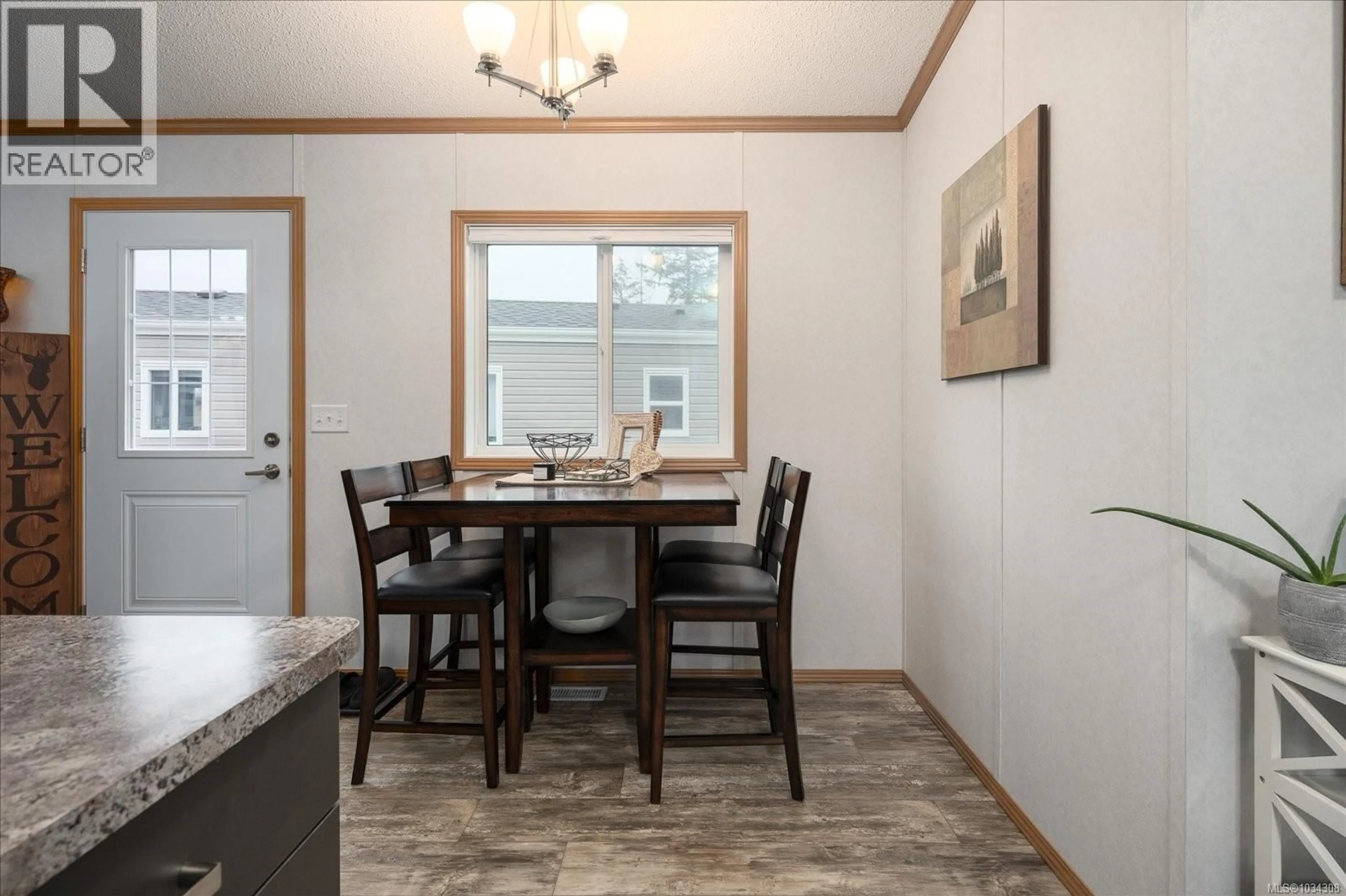 Dining room, wood/laminate floor for 11 - 6820 PARKLANDS PLACE, Lantzville British Columbia V0R2H0