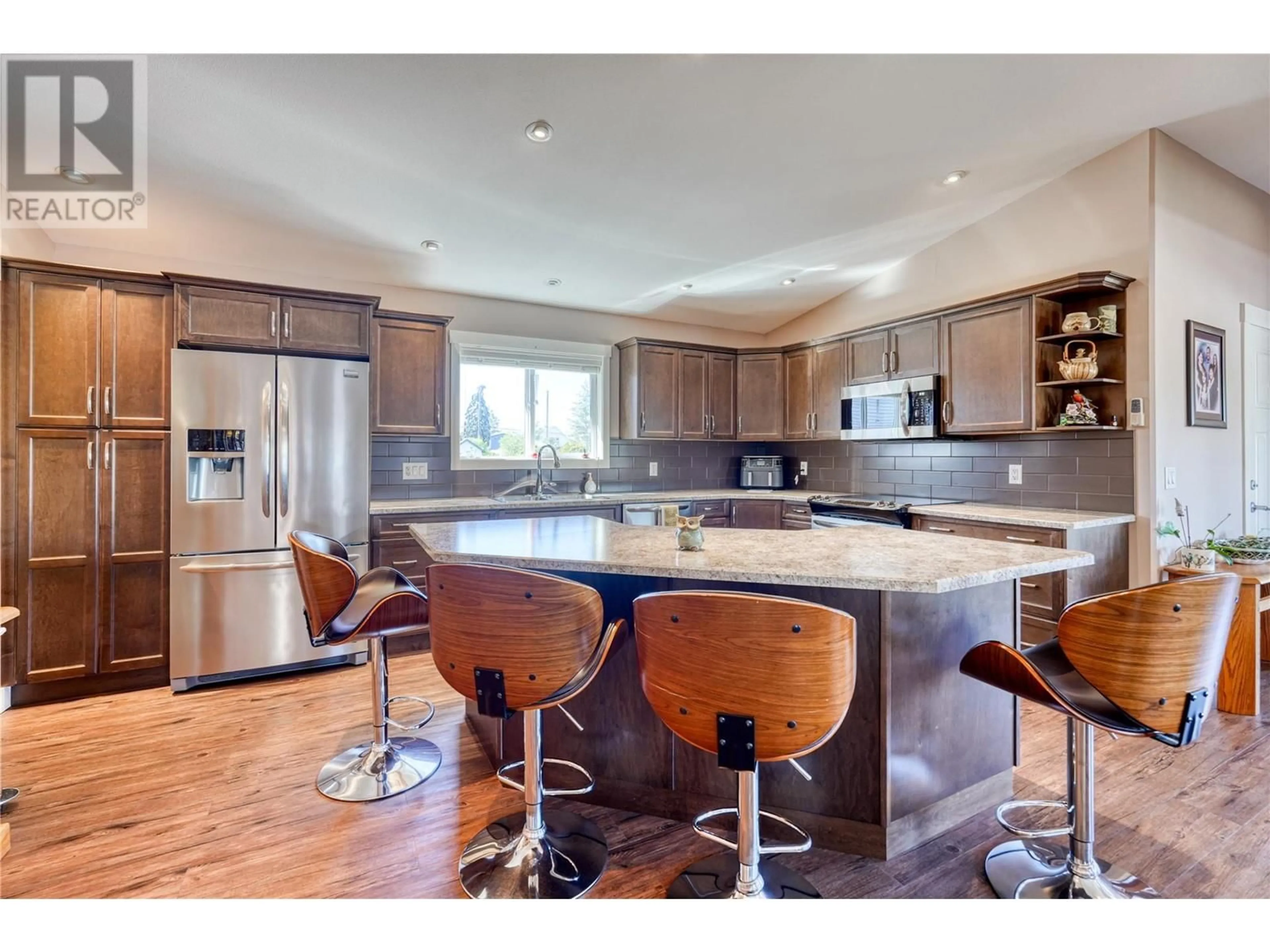 Open concept kitchen, wood/laminate floor for 760 BIRD STREET, Penticton British Columbia V2A6Z5