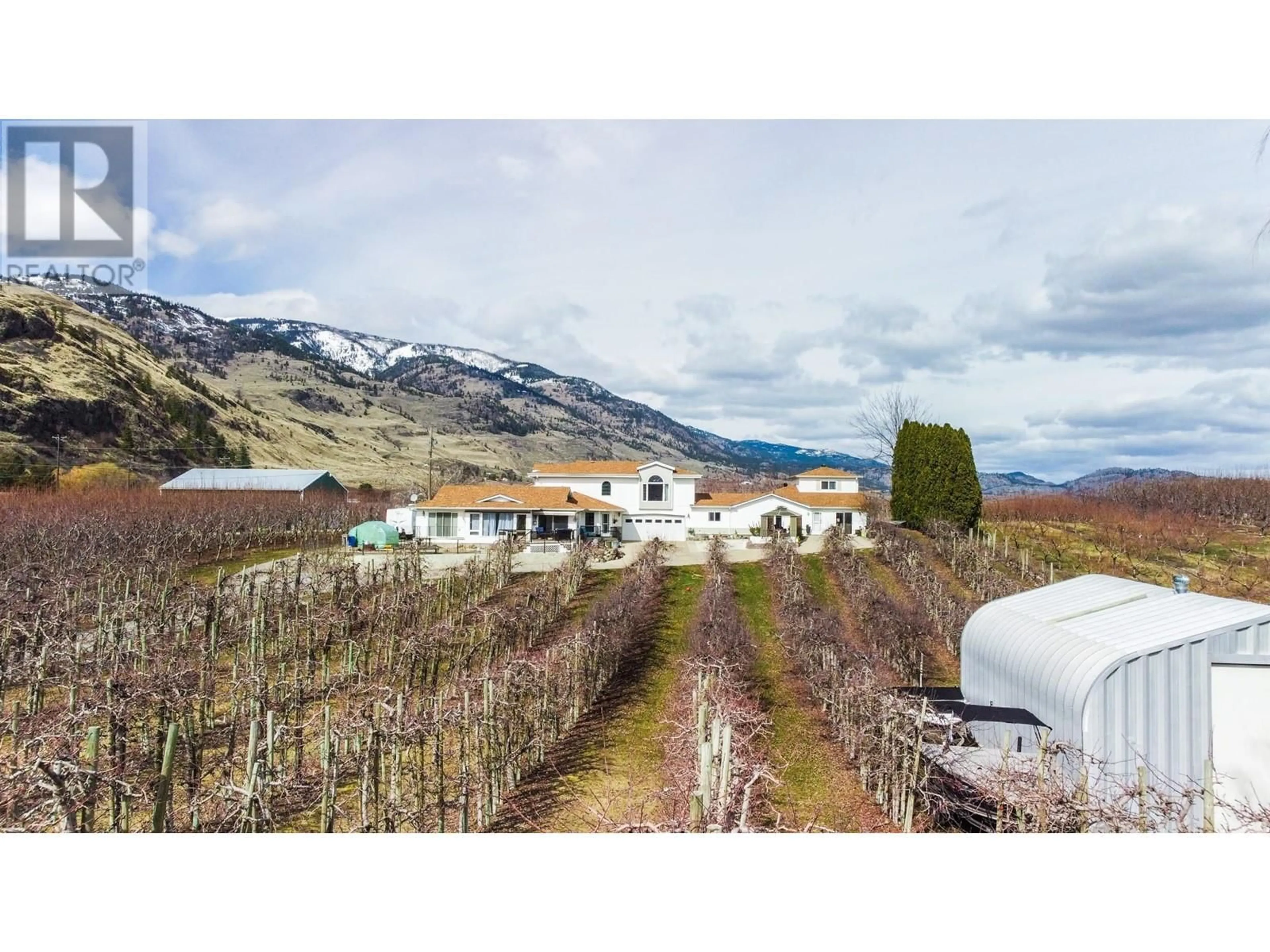 A pic from outside/outdoor area/front of a property/back of a property/a pic from drone, mountain view for 384 19 ROAD, Oliver British Columbia V0H1T1