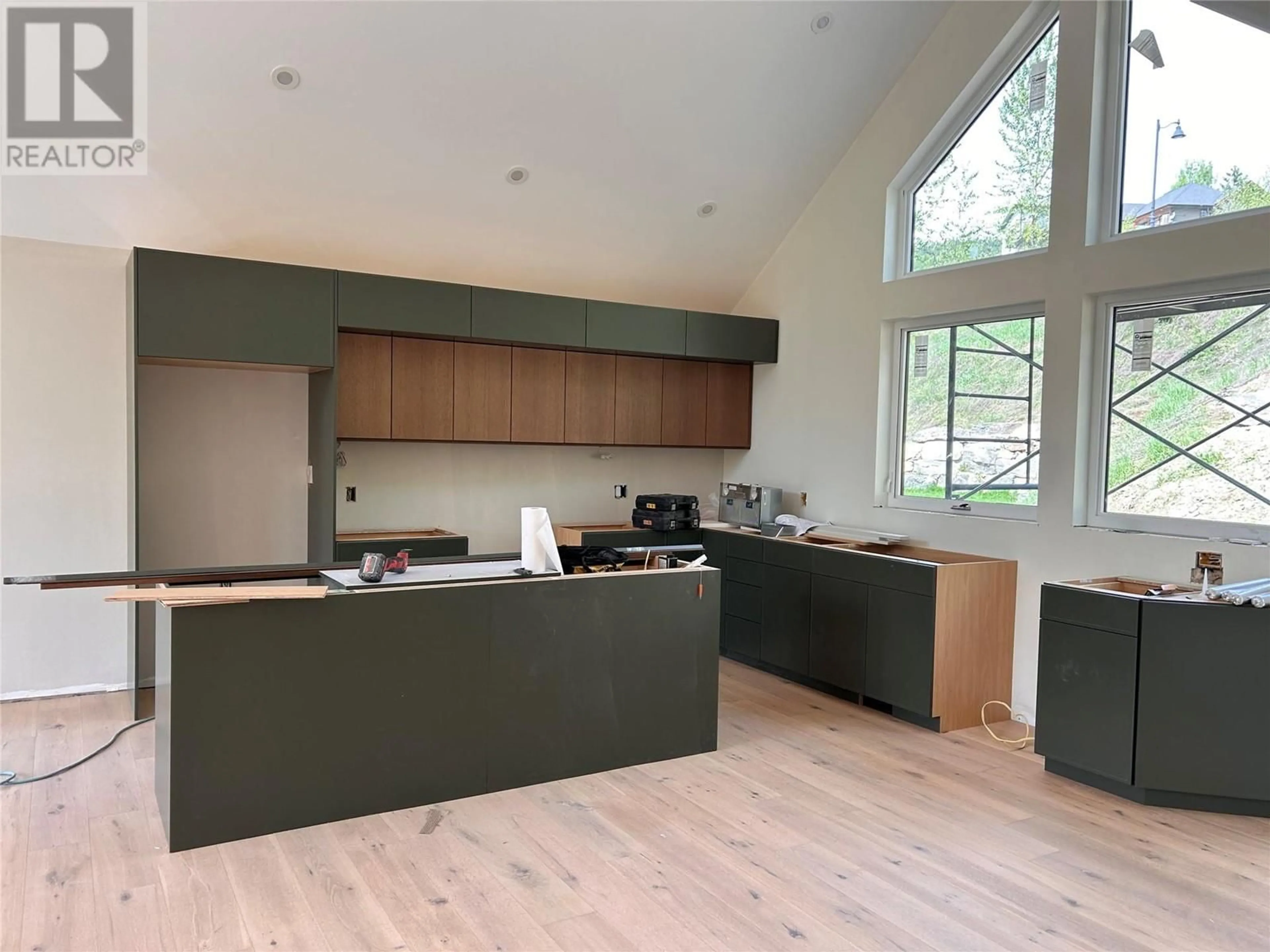 Open concept kitchen, wood/laminate floor for 798 WHITE TAIL DRIVE, Rossland British Columbia V0G1Y0