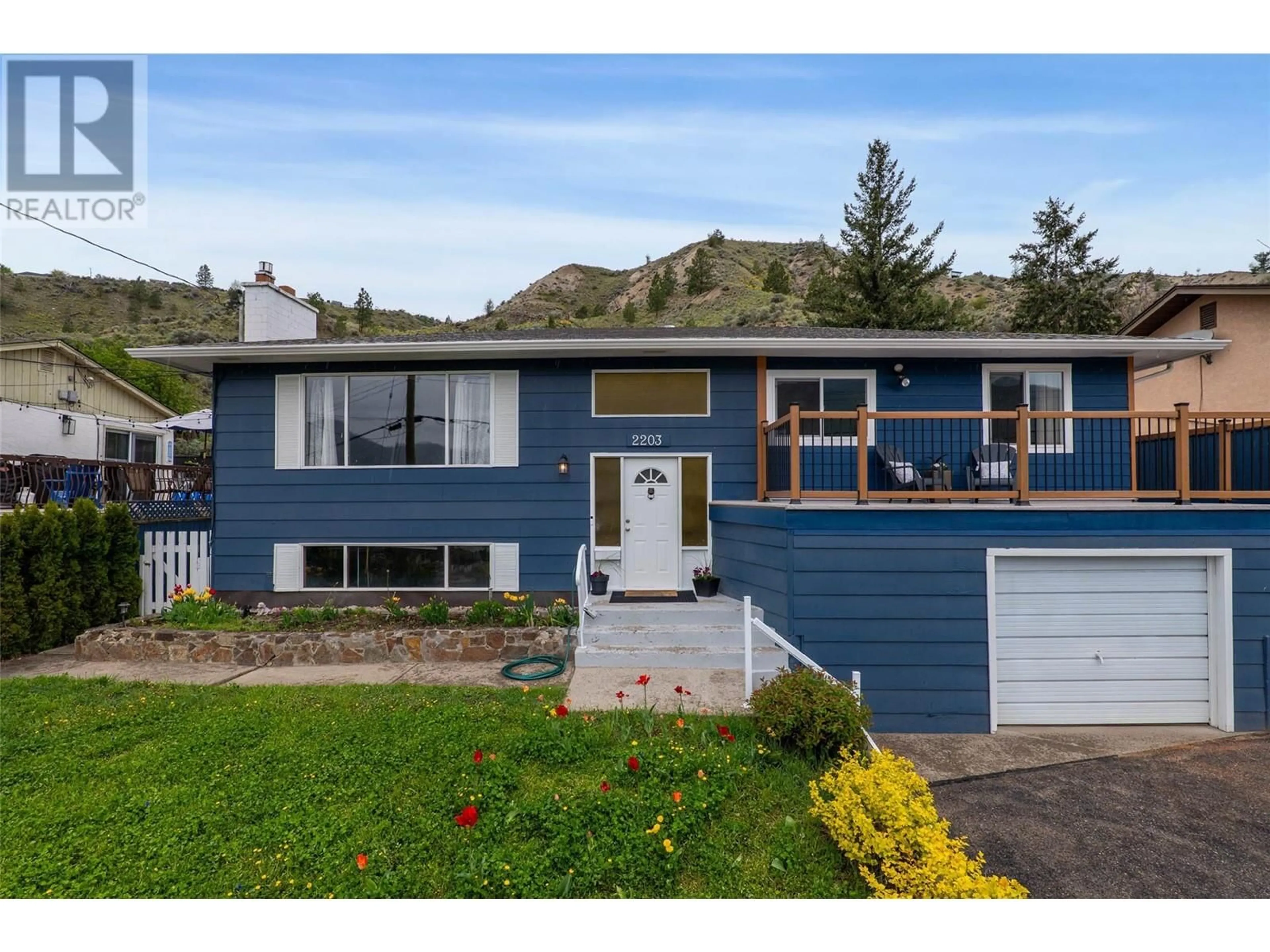 Home with vinyl exterior material, street for 2203 GRASSLANDS BOULEVARD, Kamloops British Columbia V2B6E4