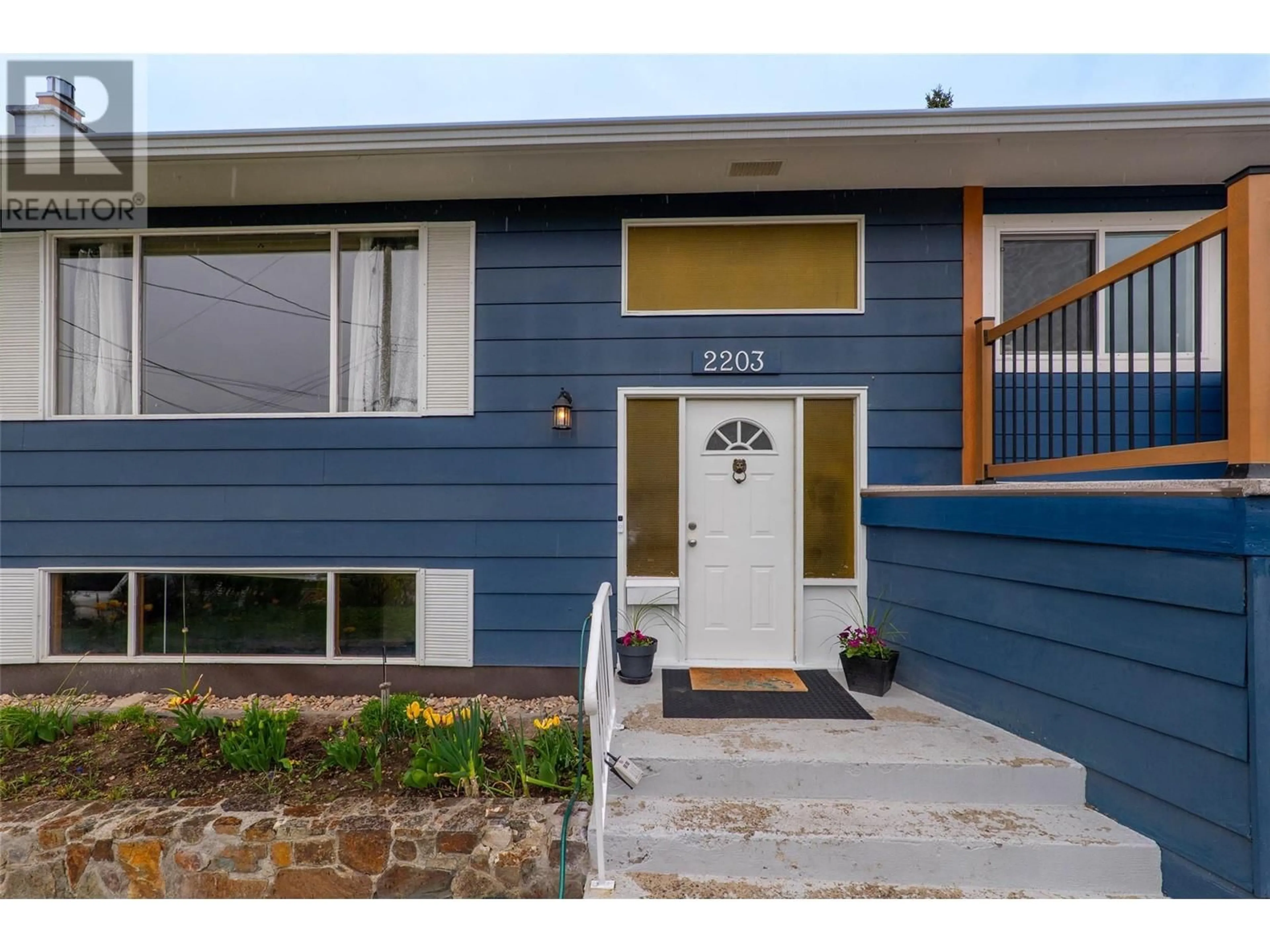 Home with vinyl exterior material, street for 2203 GRASSLANDS BOULEVARD, Kamloops British Columbia V2B6E4