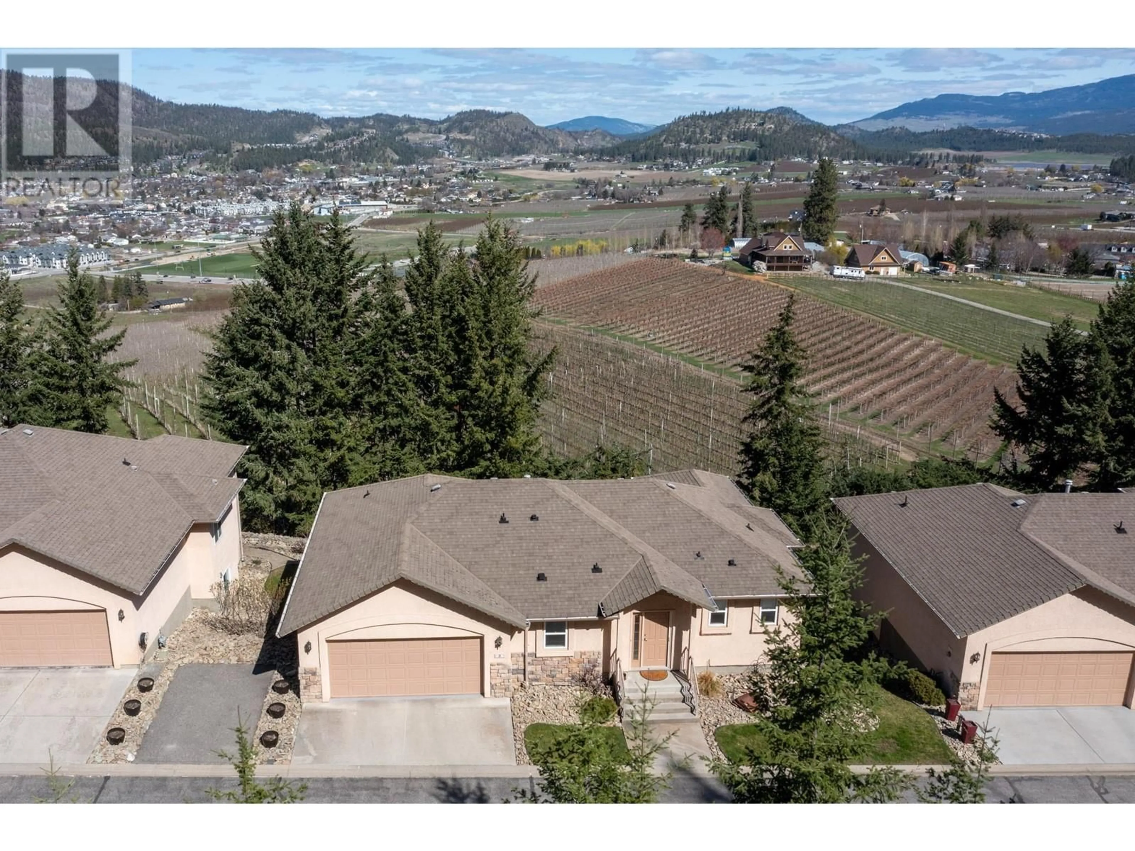 A pic from outside/outdoor area/front of a property/back of a property/a pic from drone, mountain view for 2 - 2300 SILVER PLACE, Kelowna British Columbia V1V2L5