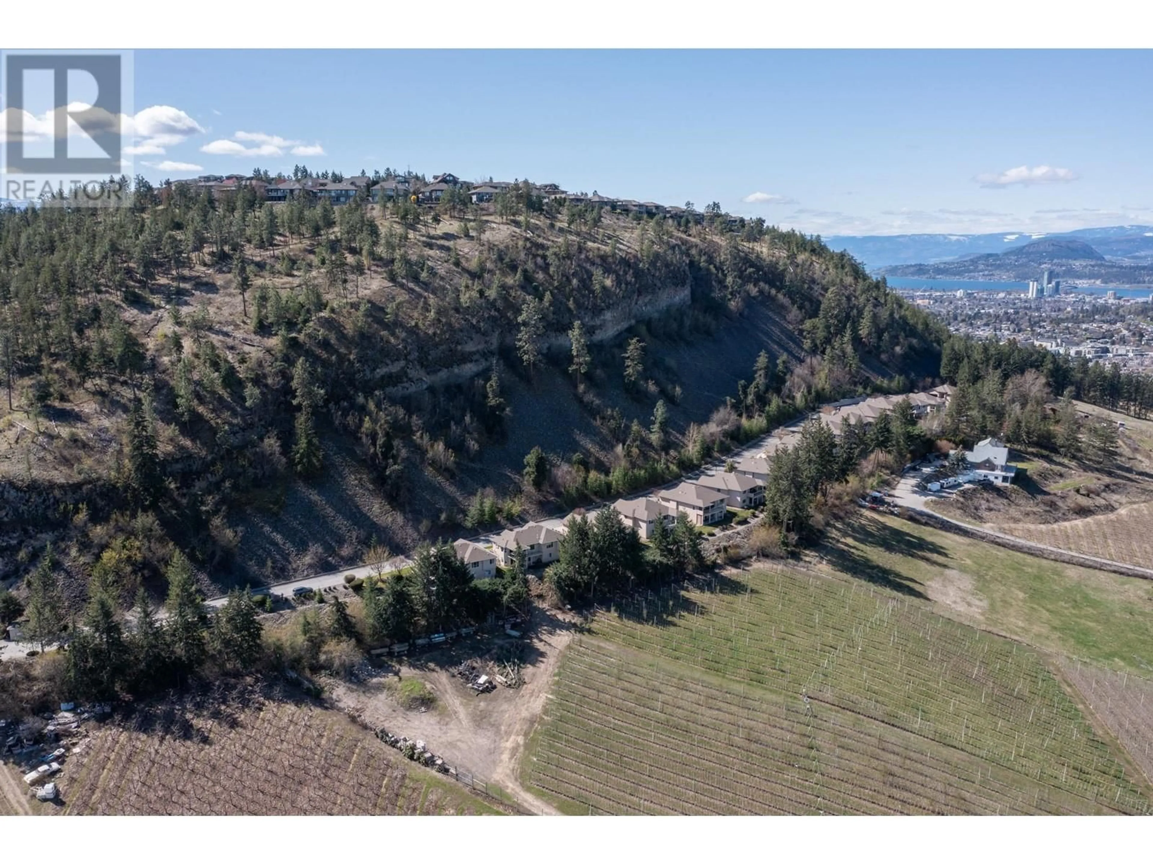 A pic from outside/outdoor area/front of a property/back of a property/a pic from drone, mountain view for 2 - 2300 SILVER PLACE, Kelowna British Columbia V1V2L5