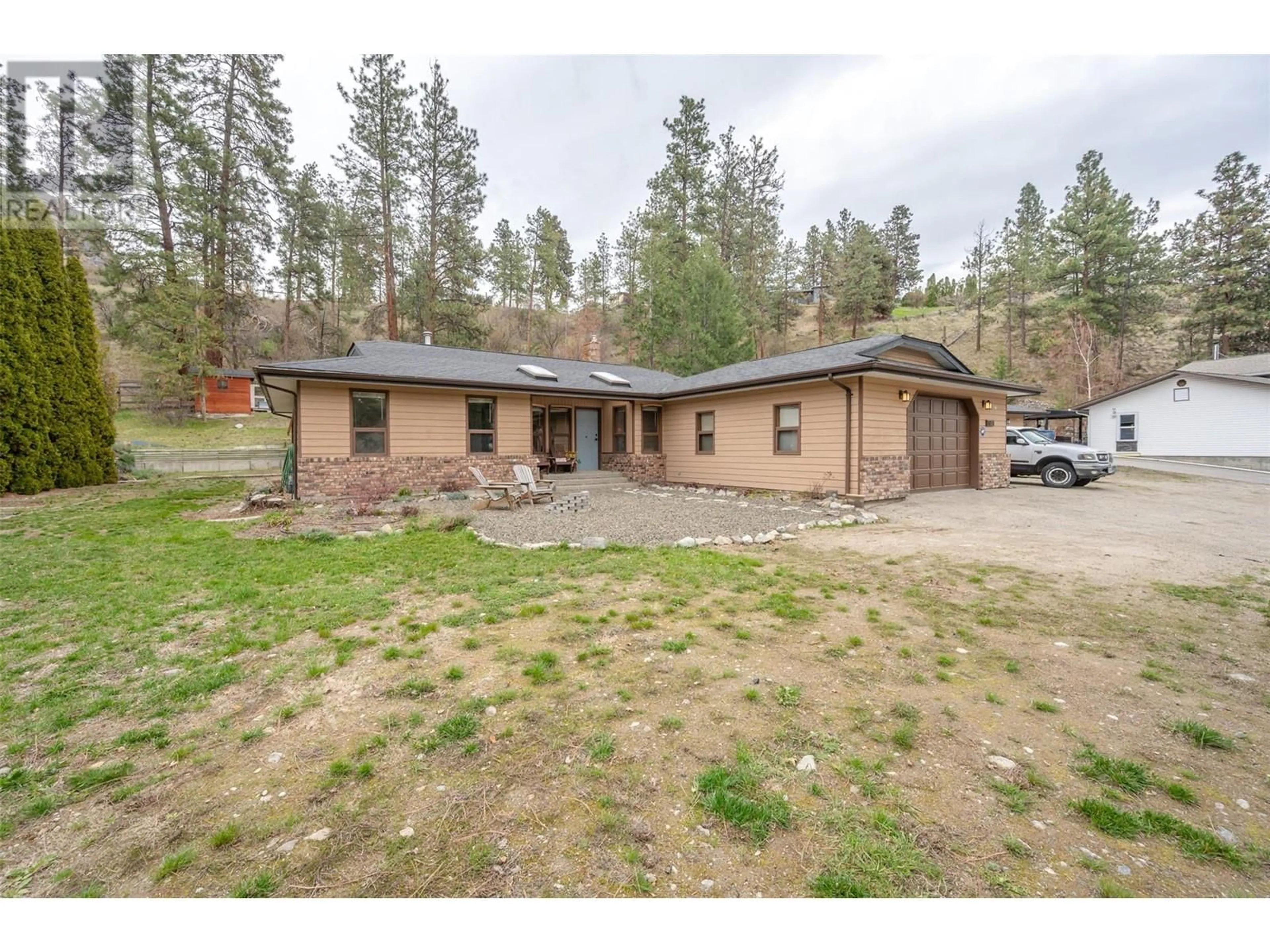 A pic from outside/outdoor area/front of a property/back of a property/a pic from drone, unknown for 8015 VICTORIA ROAD SOUTH, Summerland British Columbia V0H1Z2