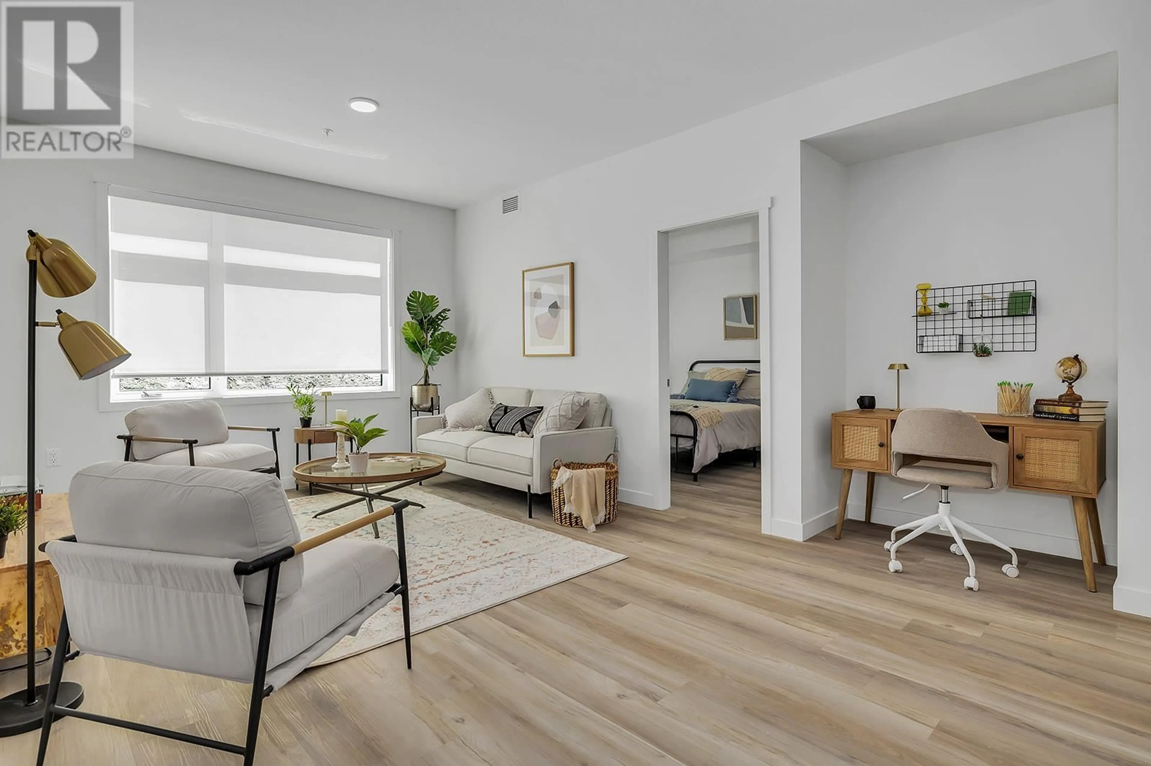 Living room with furniture, wood/laminate floor for 311 - 1111 FROST ROAD, Kelowna British Columbia V1W0G8
