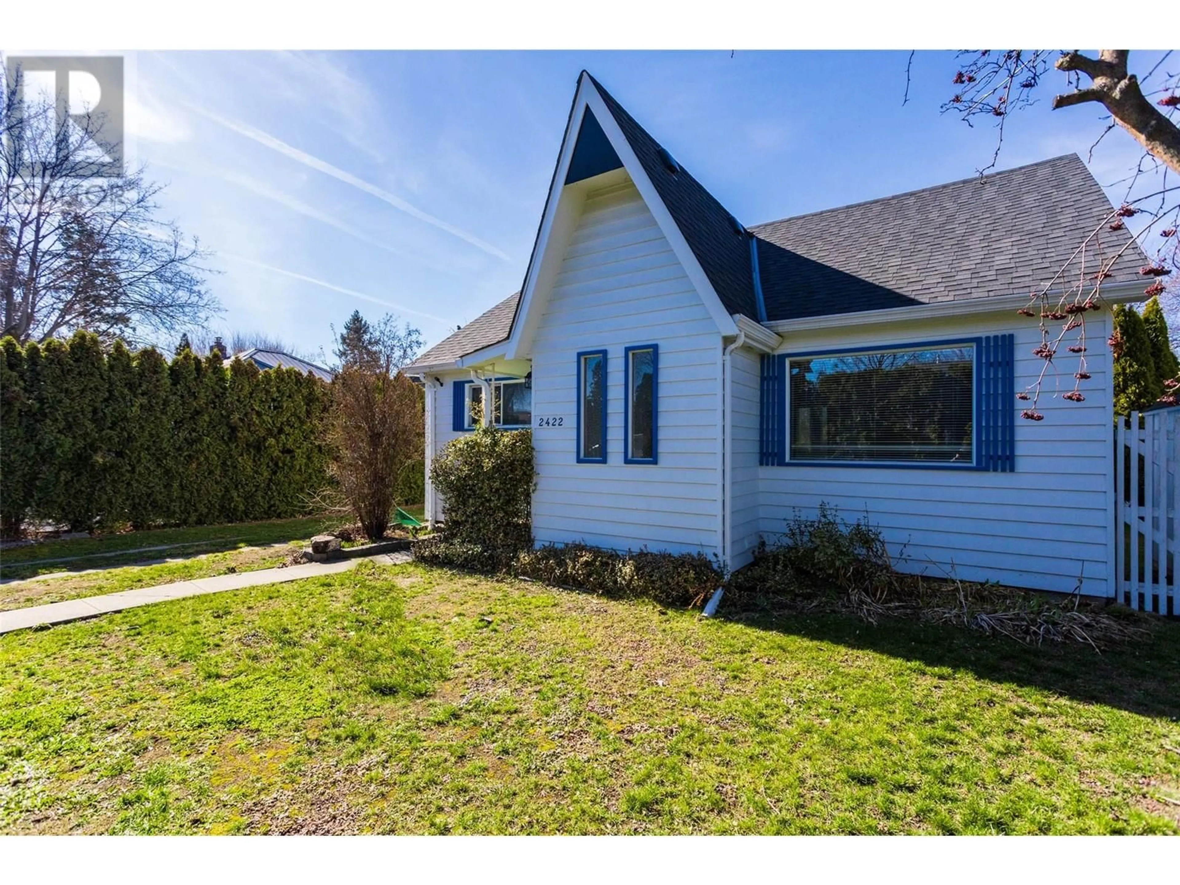 Home with vinyl exterior material, street for 2422 RICHTER STREET, Kelowna British Columbia V1Y2P6