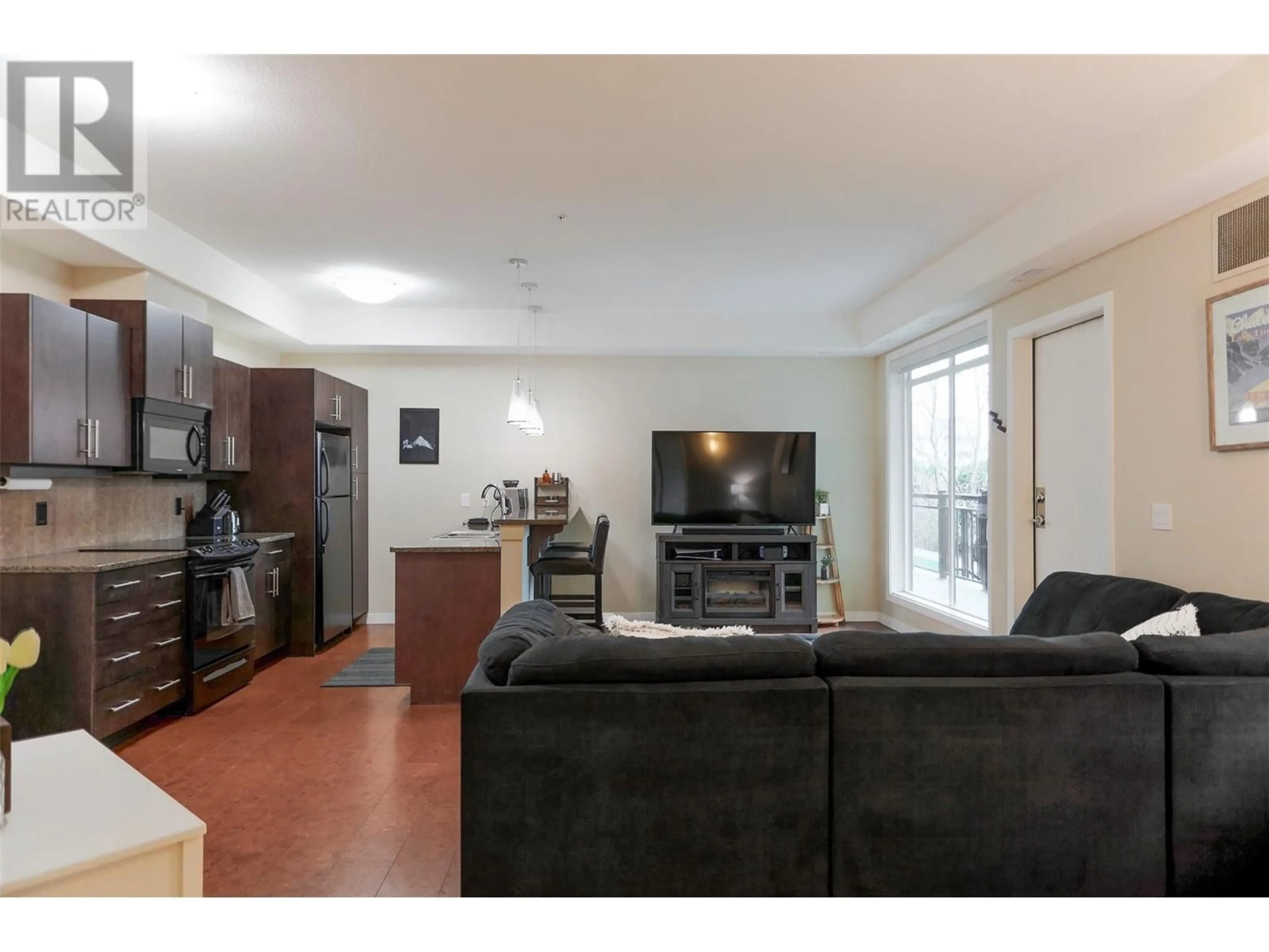 Living room with furniture, unknown for 103 - 2011 AGASSIZ ROAD, Kelowna British Columbia V1Y9Z8