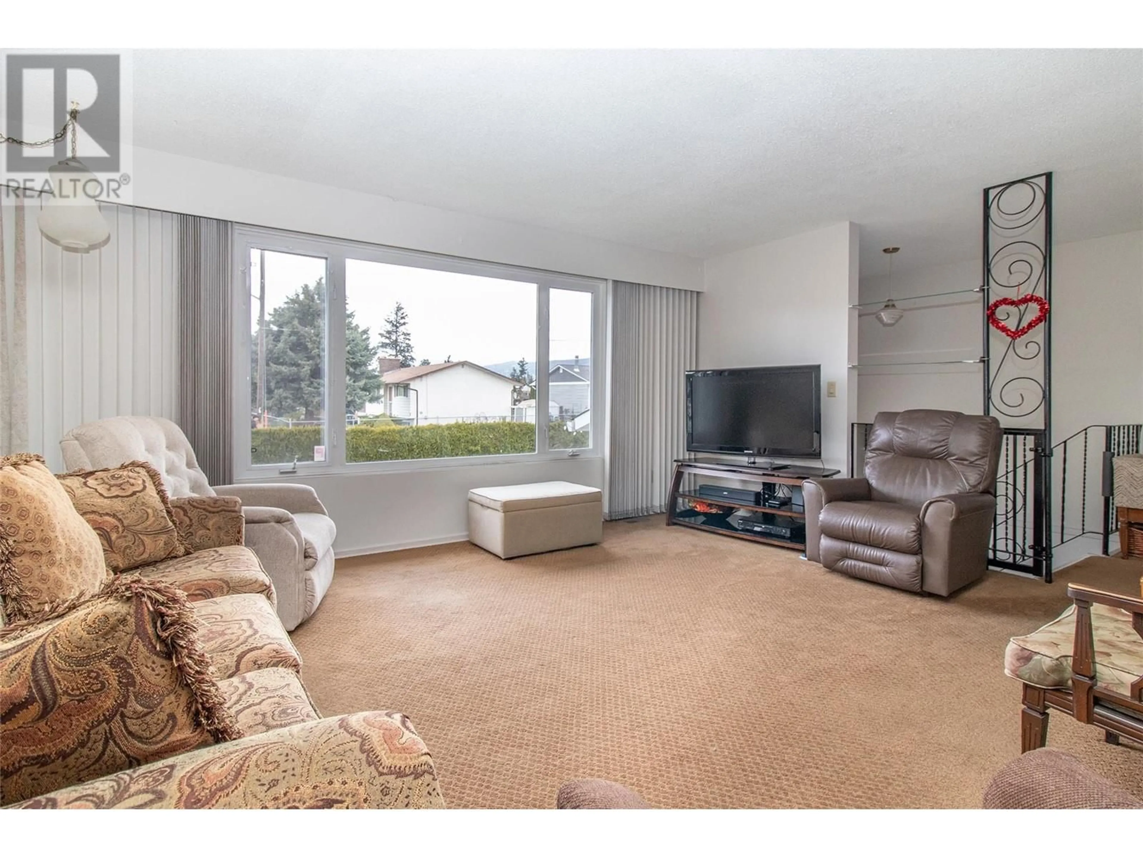 Living room with furniture, unknown for 235 PEARSON ROAD, Kelowna British Columbia V1X2L5