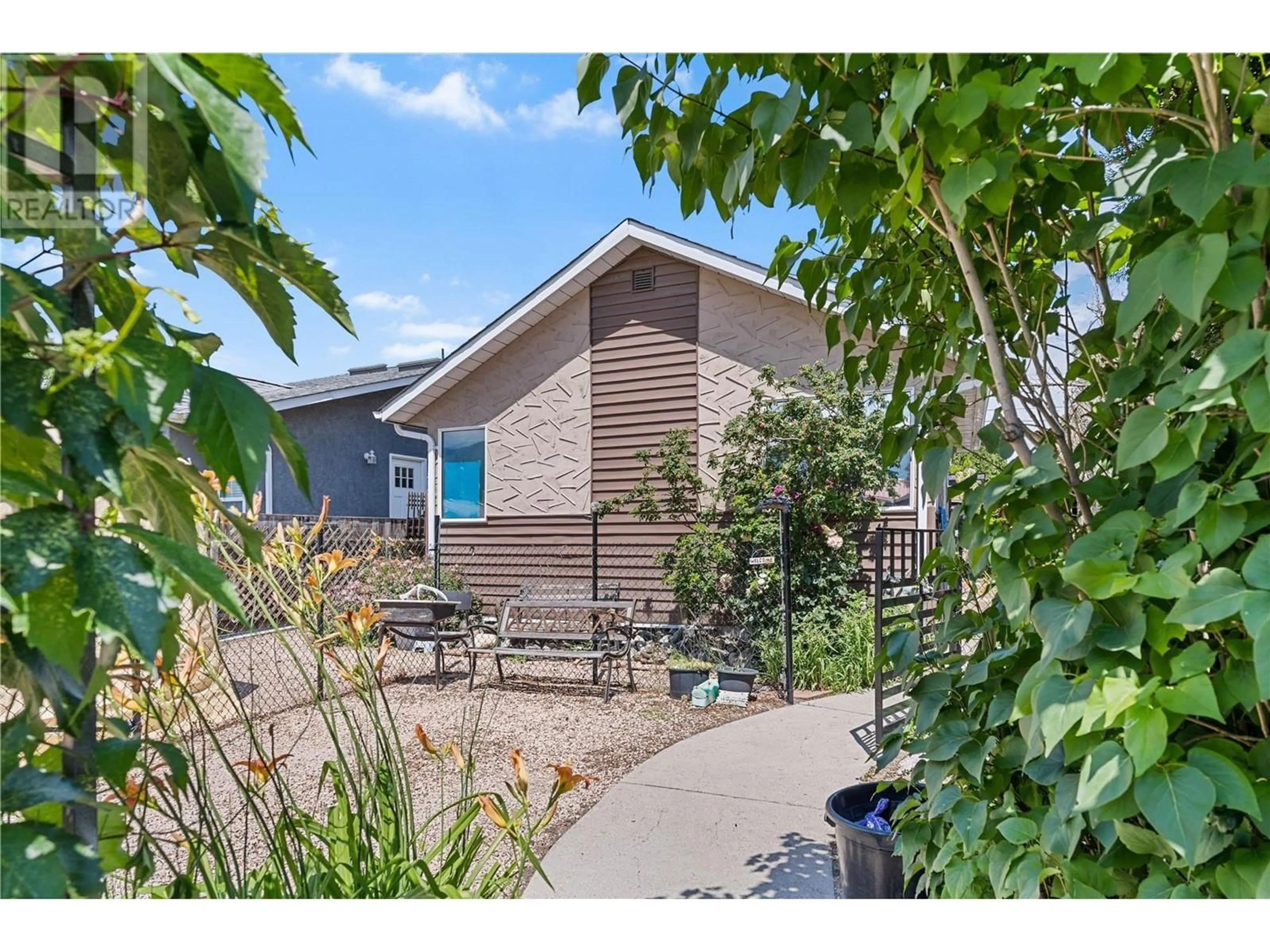 A pic from outside/outdoor area/front of a property/back of a property/a pic from drone, street for 731 REVELSTOKE AVENUE, Penticton British Columbia V2A2J1