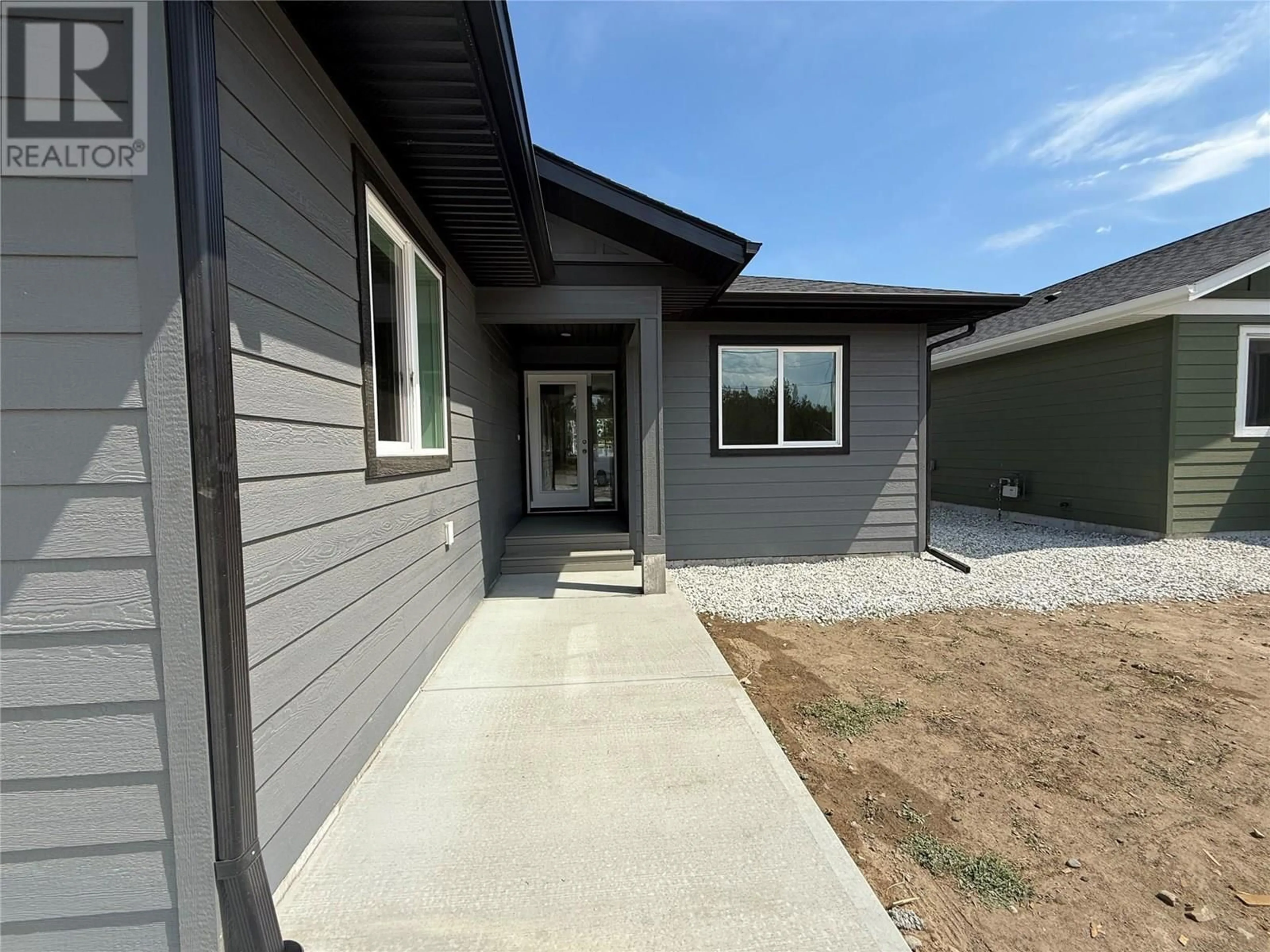Home with vinyl exterior material, street for 6070 19TH STREET, Grand Forks British Columbia V0H1H0
