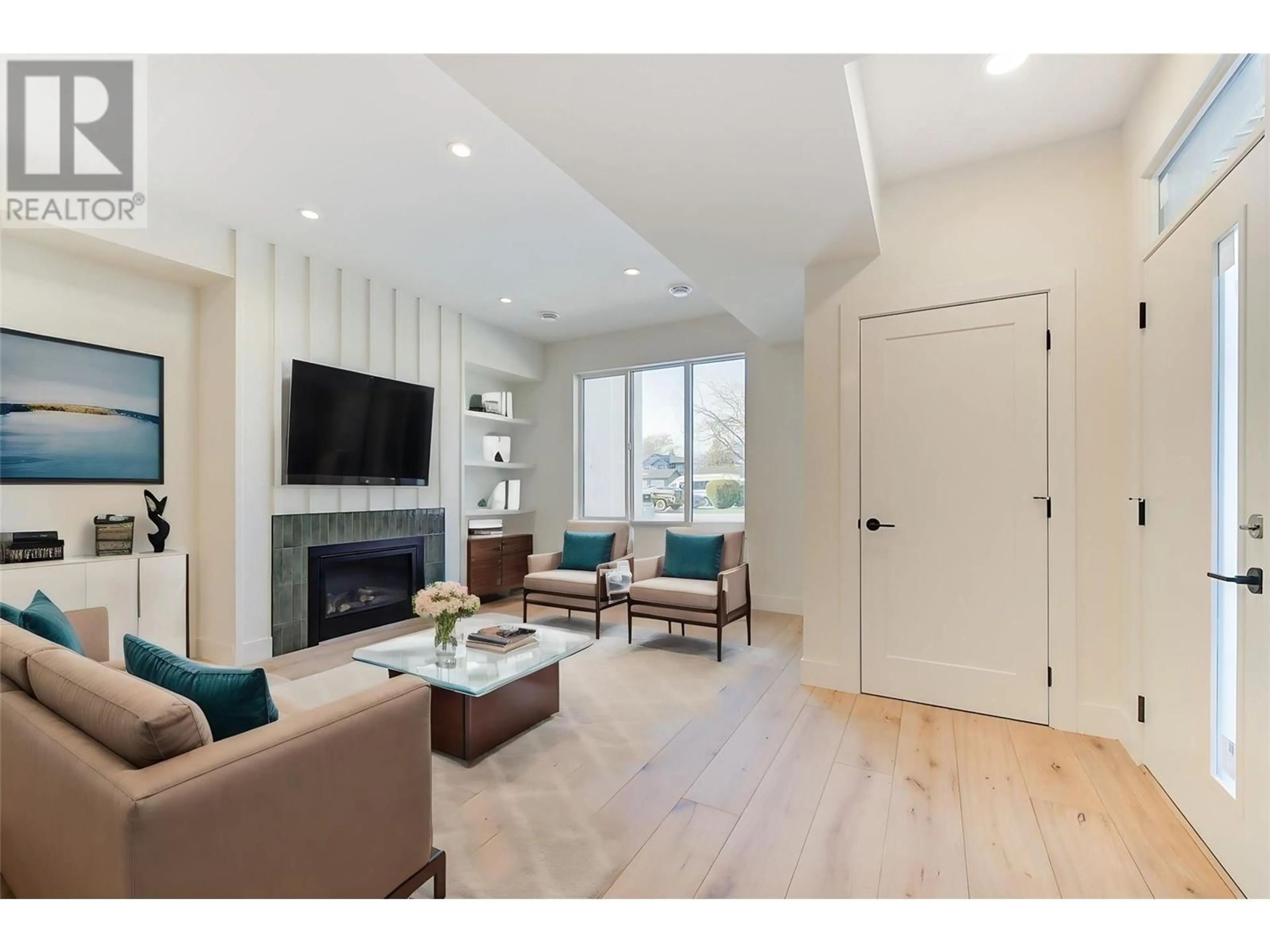 Living room with furniture, wood/laminate floor for 857 KINNEAR COURT, Kelowna British Columbia V1Y8A9