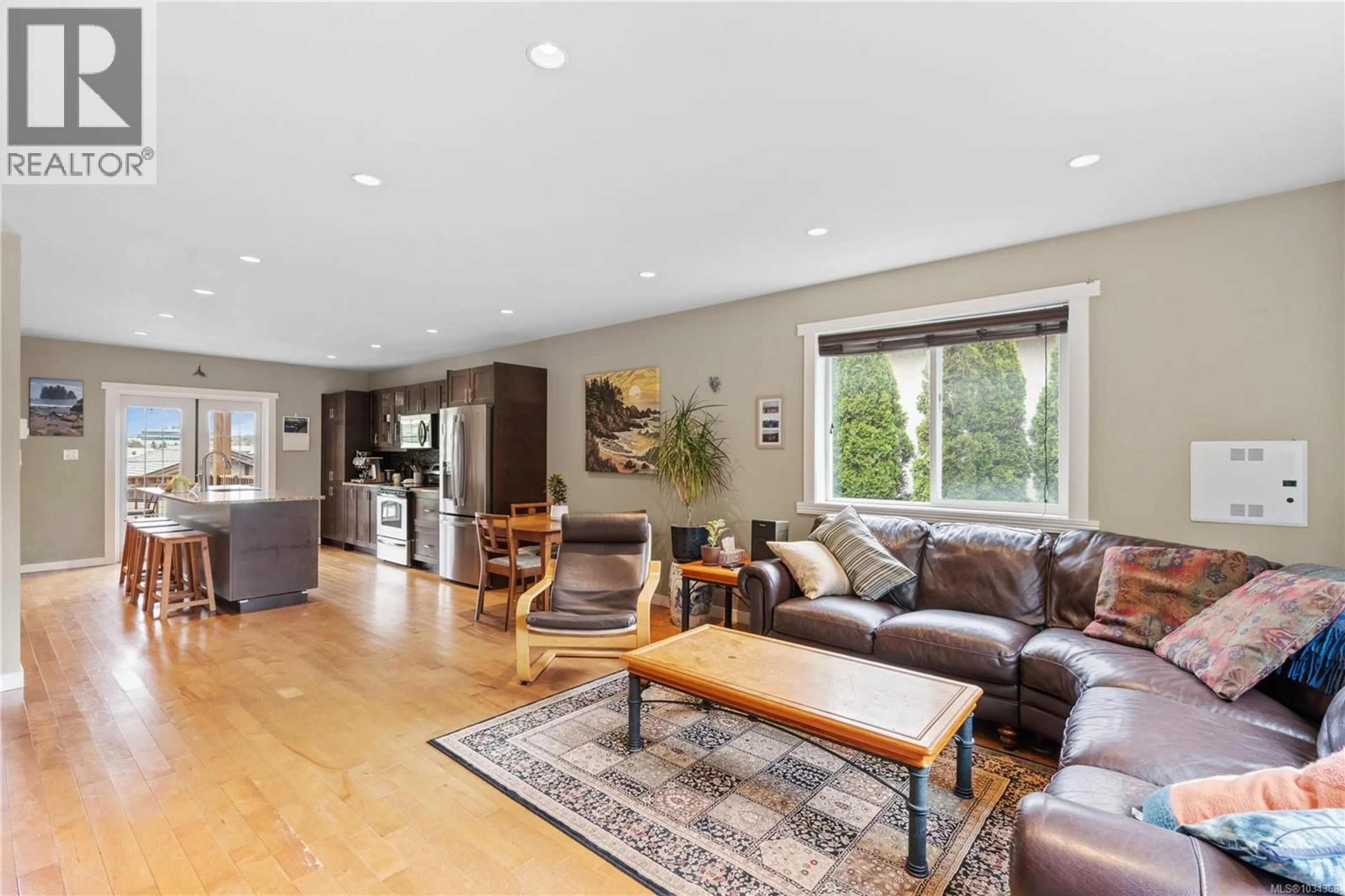 Living room with furniture, wood/laminate floor for 167 LITTLE ELDON PLACE, Saanich British Columbia V8Z1E2