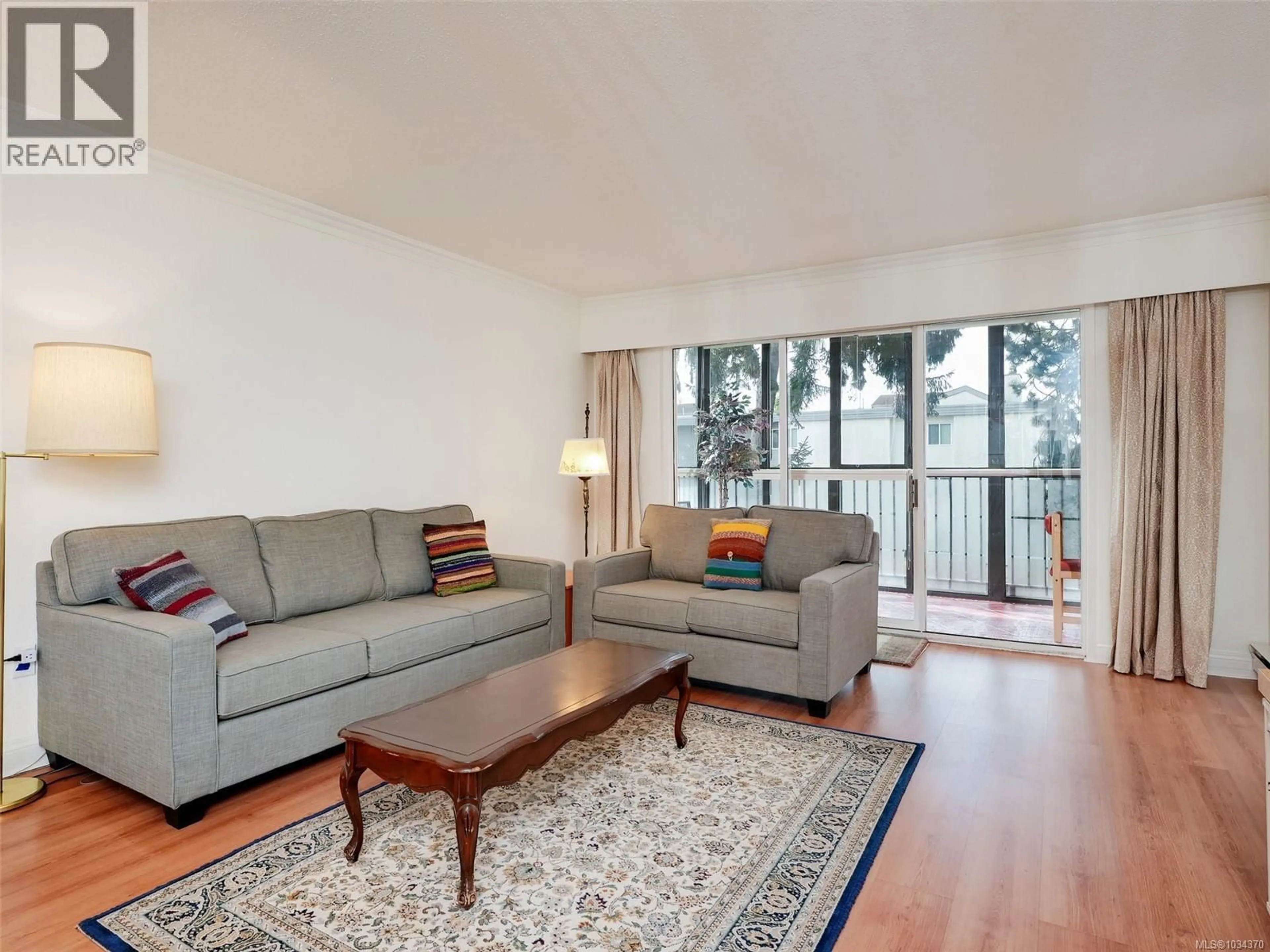 Living room with furniture, wood/laminate floor for 302 - 1101 HILDA STREET, Victoria British Columbia V8V4T2