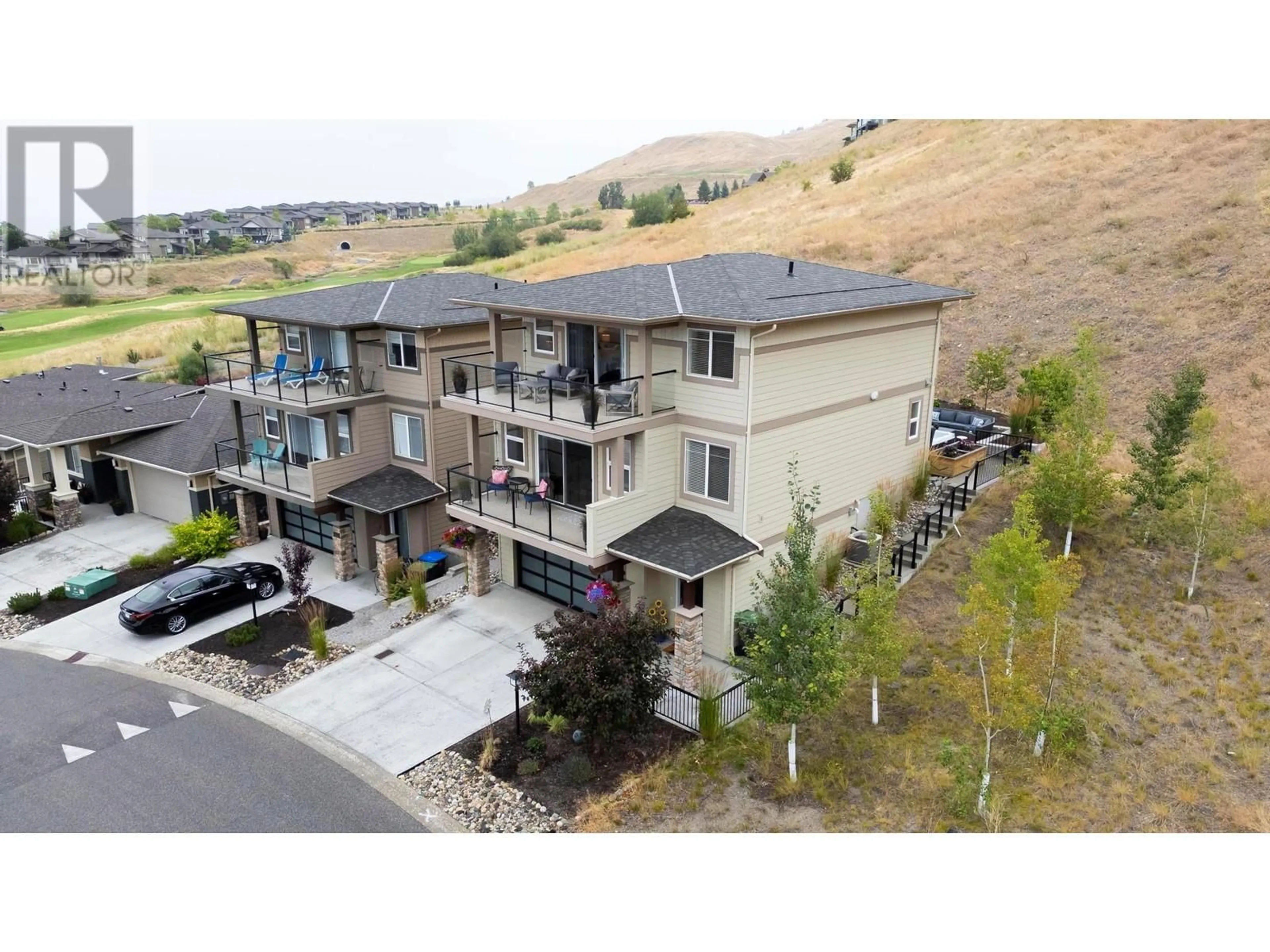 A pic from outside/outdoor area/front of a property/back of a property/a pic from drone, mountain view for 1524 TOWER RANCH DRIVE, Kelowna British Columbia V1P1T8