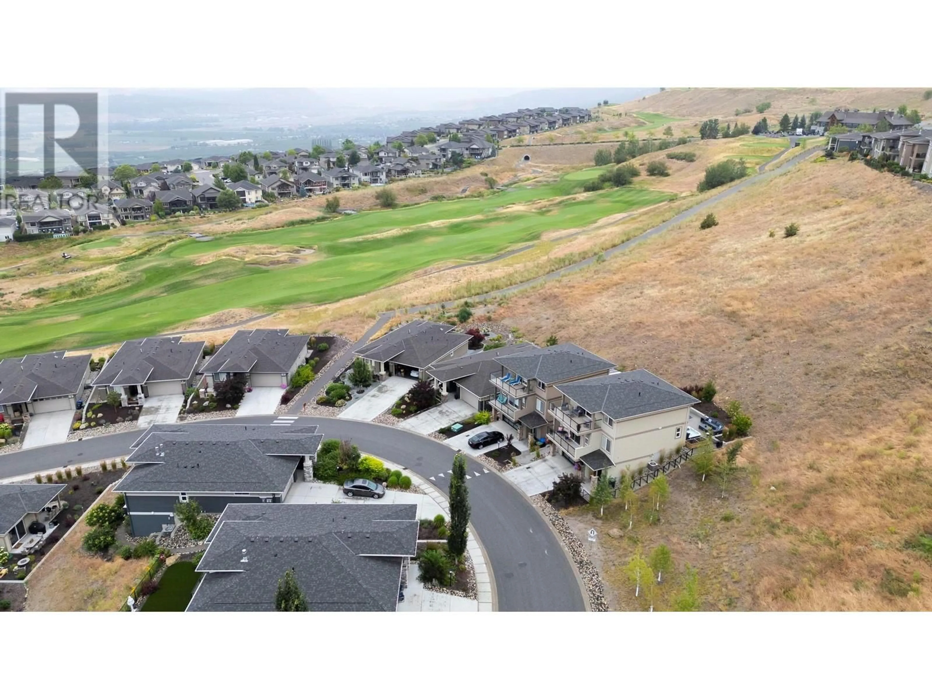 A pic from outside/outdoor area/front of a property/back of a property/a pic from drone, mountain view for 1524 TOWER RANCH DRIVE, Kelowna British Columbia V1P1T8
