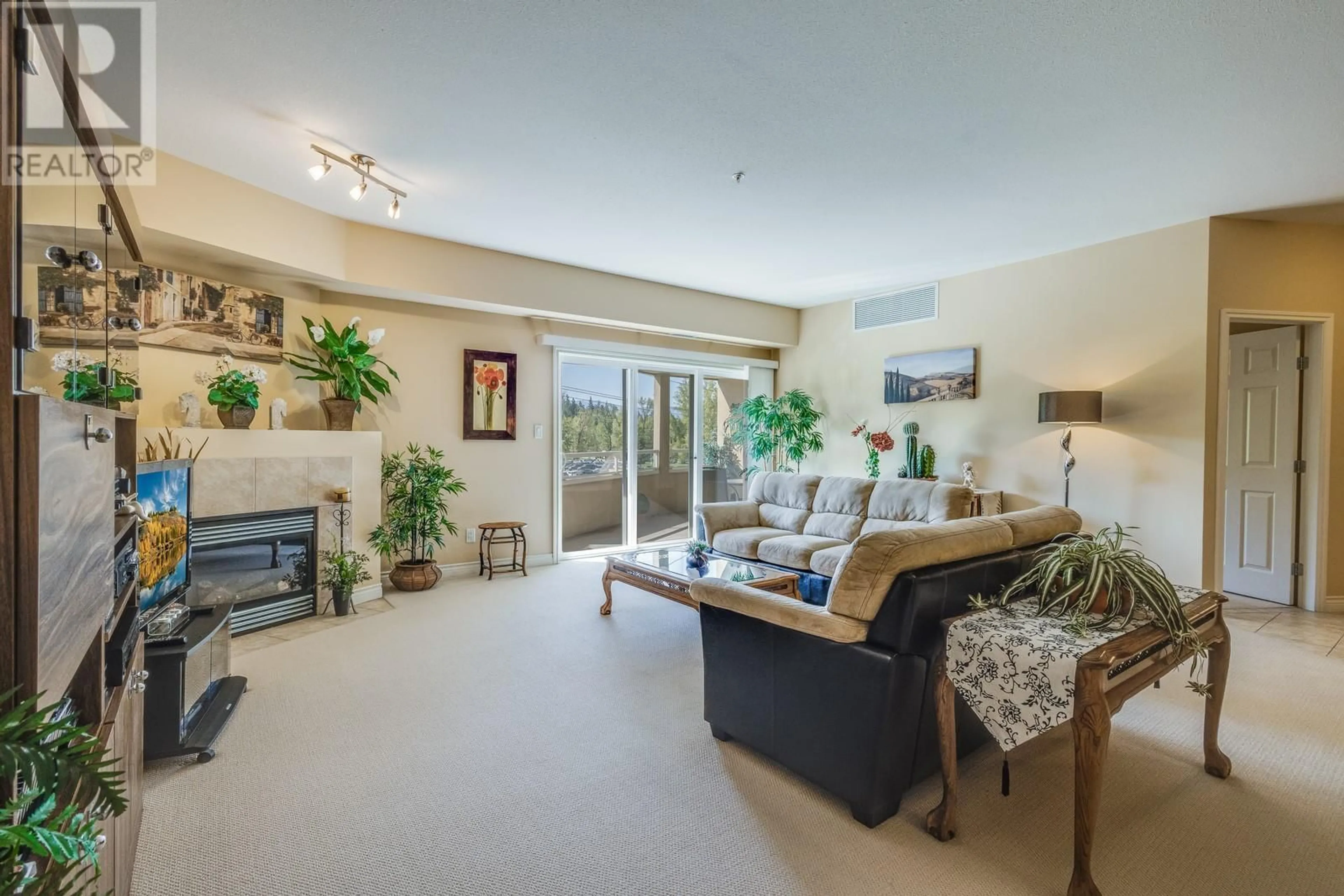 Living room with furniture, unknown for 306 - 1961 DURNIN ROAD, Kelowna British Columbia V1X7Z6