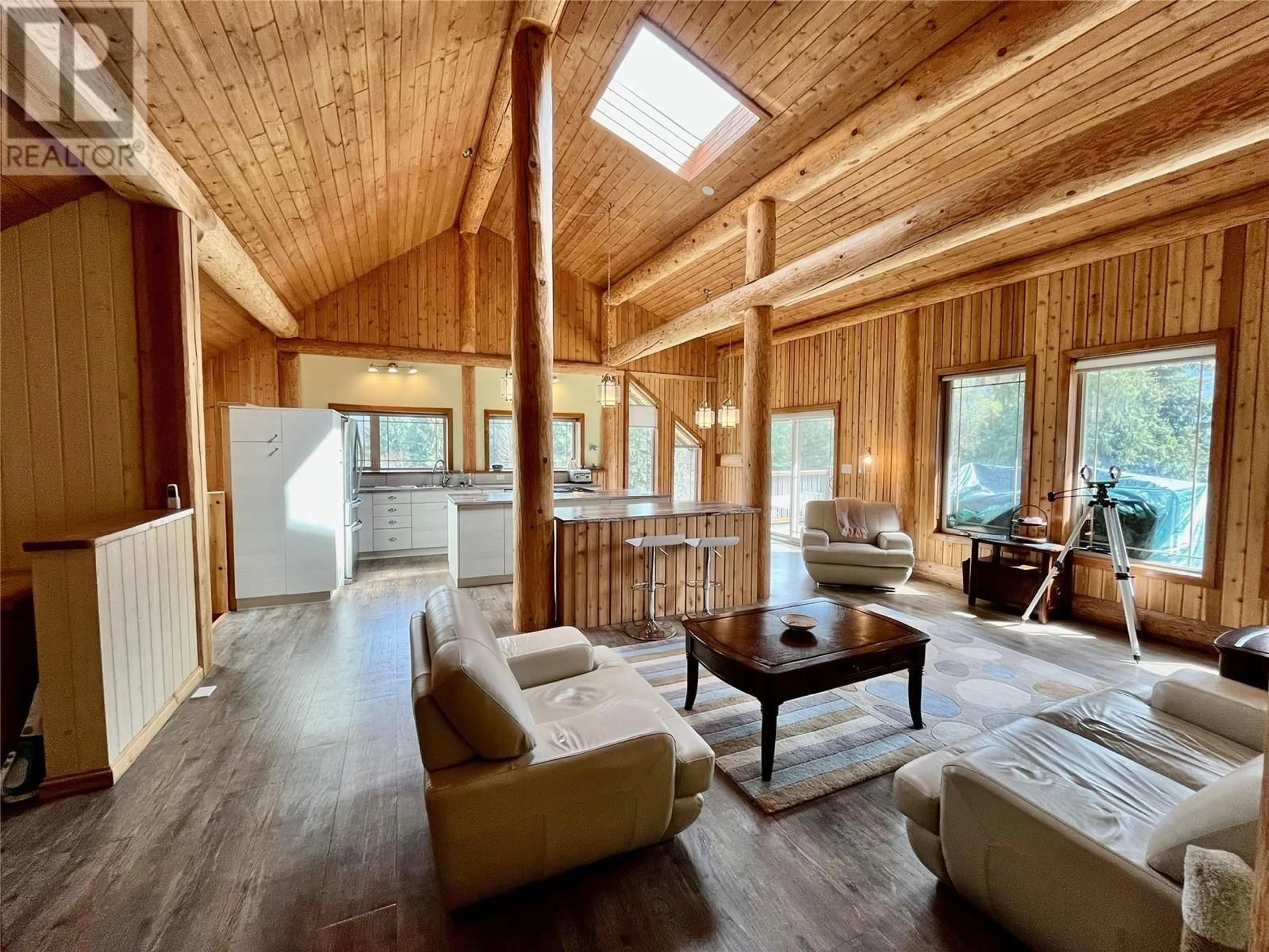 Living room with furniture, wood/laminate floor for 2030 SOLSQUA - SICAMOUS ROAD, Sicamous British Columbia V0E2V4