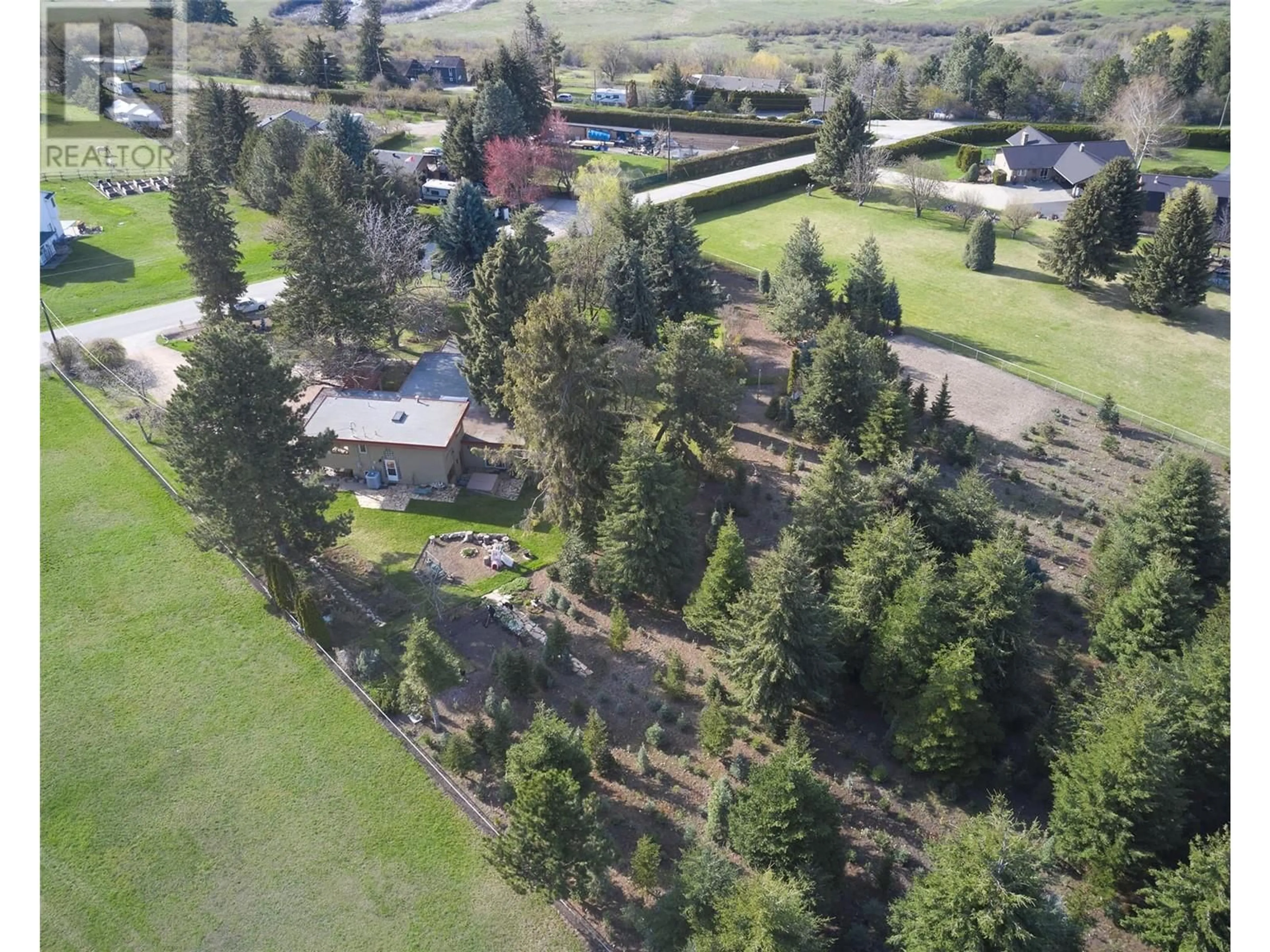 A pic from outside/outdoor area/front of a property/back of a property/a pic from drone, unknown for 239 STEPPING STONES CRESCENT, Spallumcheen British Columbia V1H1X2