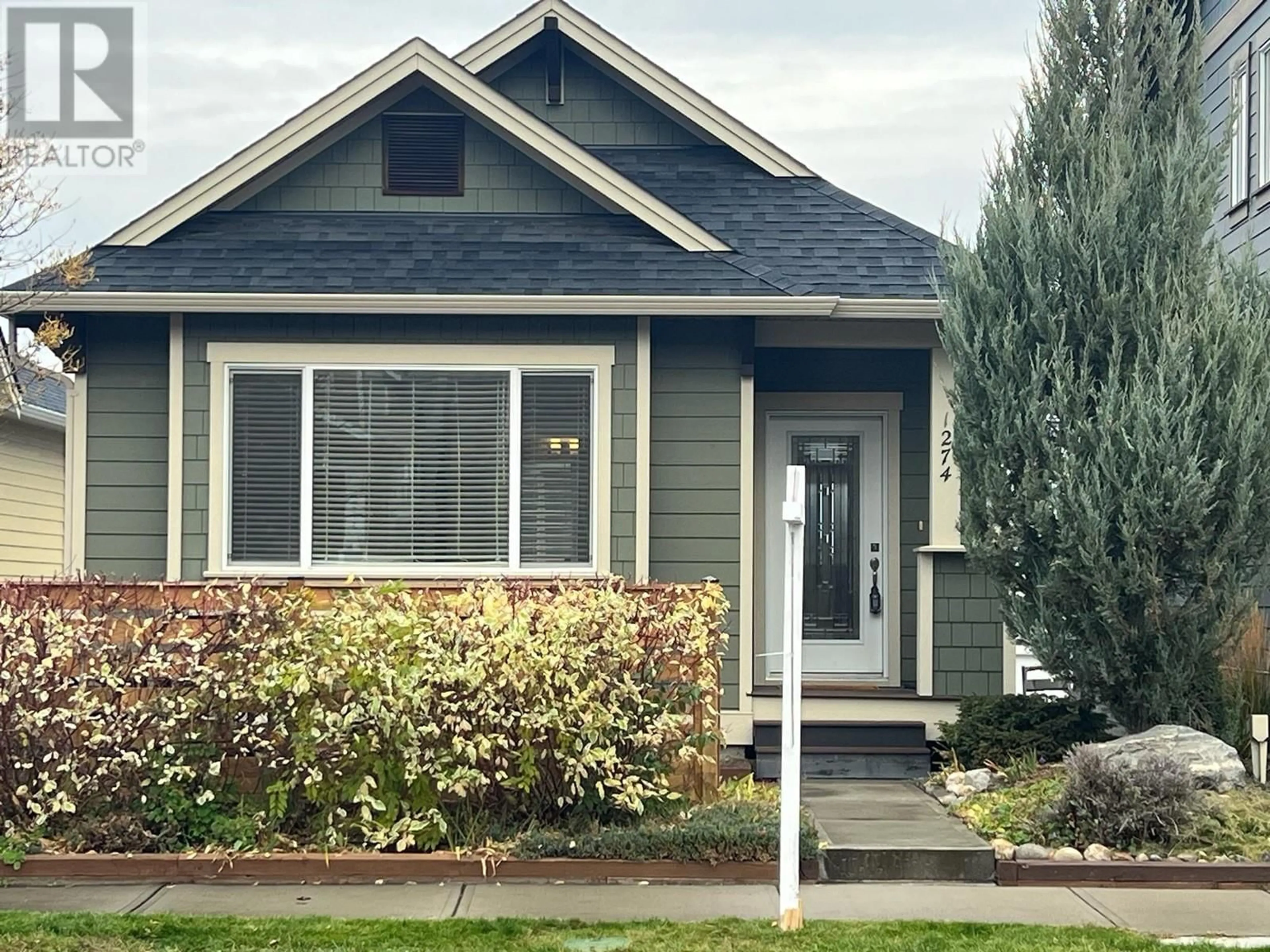 Home with vinyl exterior material, street for 1274 BERGAMOT AVENUE, Kelowna British Columbia V1W5K5