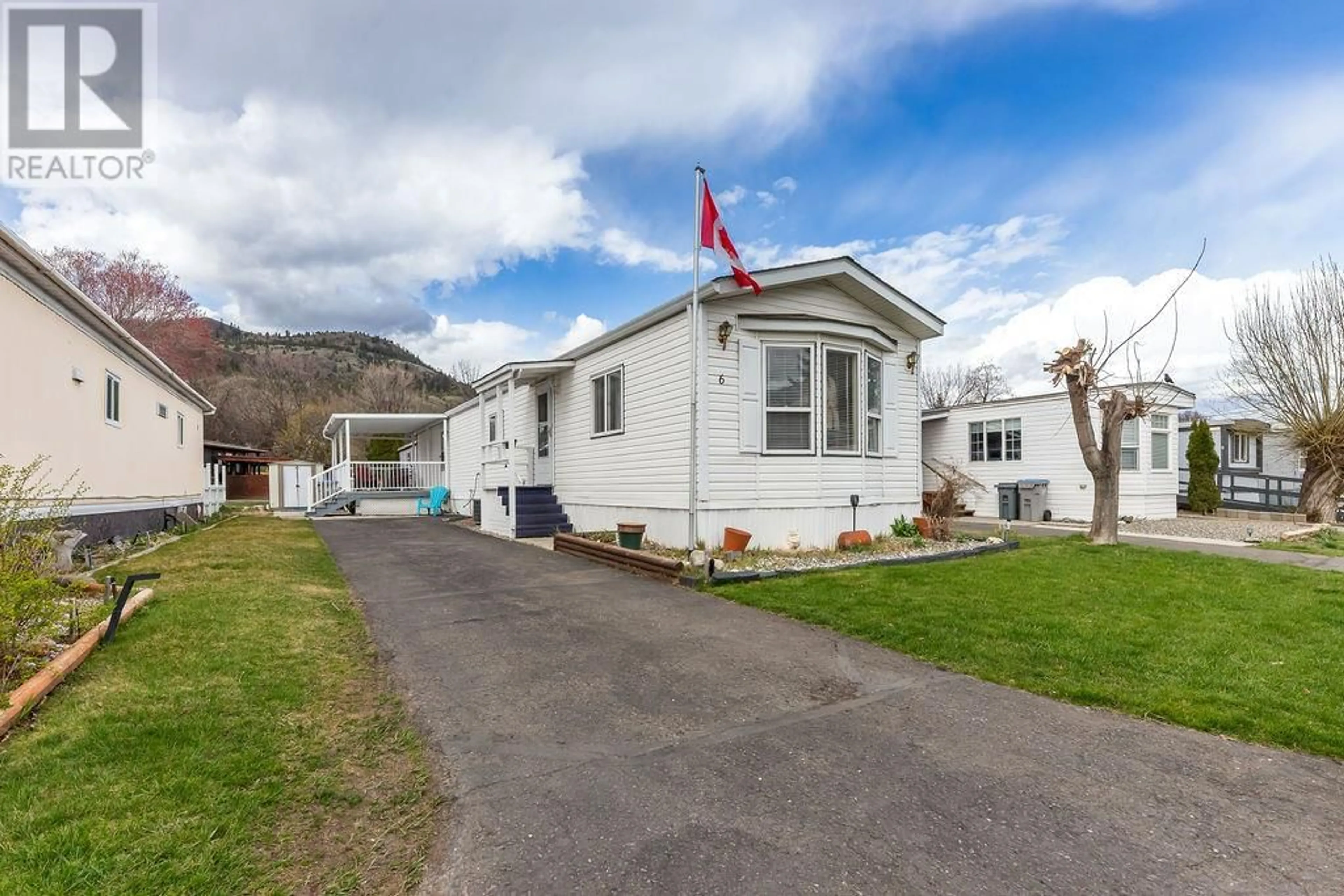 A pic from outside/outdoor area/front of a property/back of a property/a pic from drone, mountain view for 6 - 2400 OAKDALE WAY, Kamloops British Columbia V2B7C4