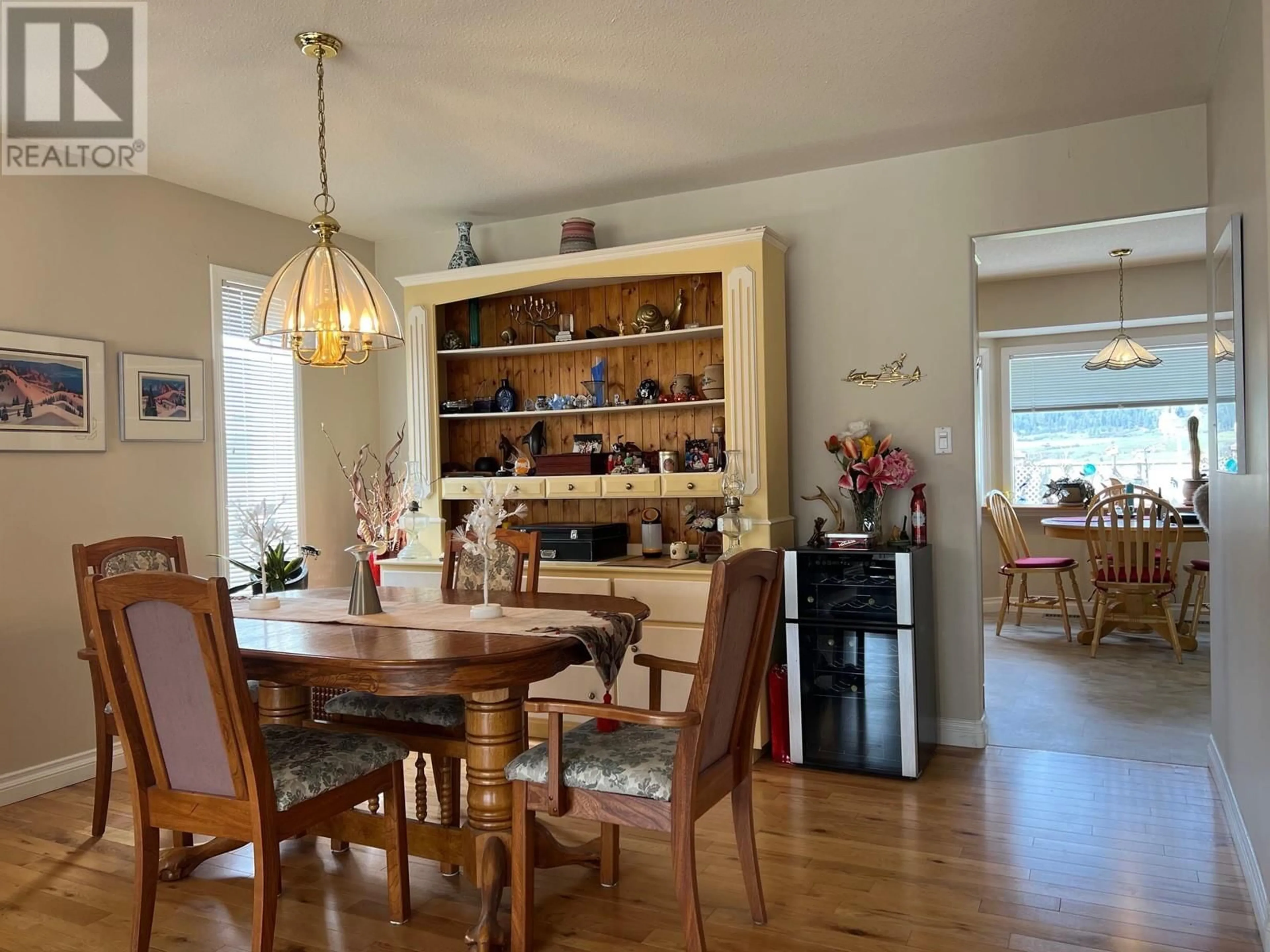 Dining room, wood/laminate floor for 101 1ST STREET, Vernon British Columbia V1H1Z1