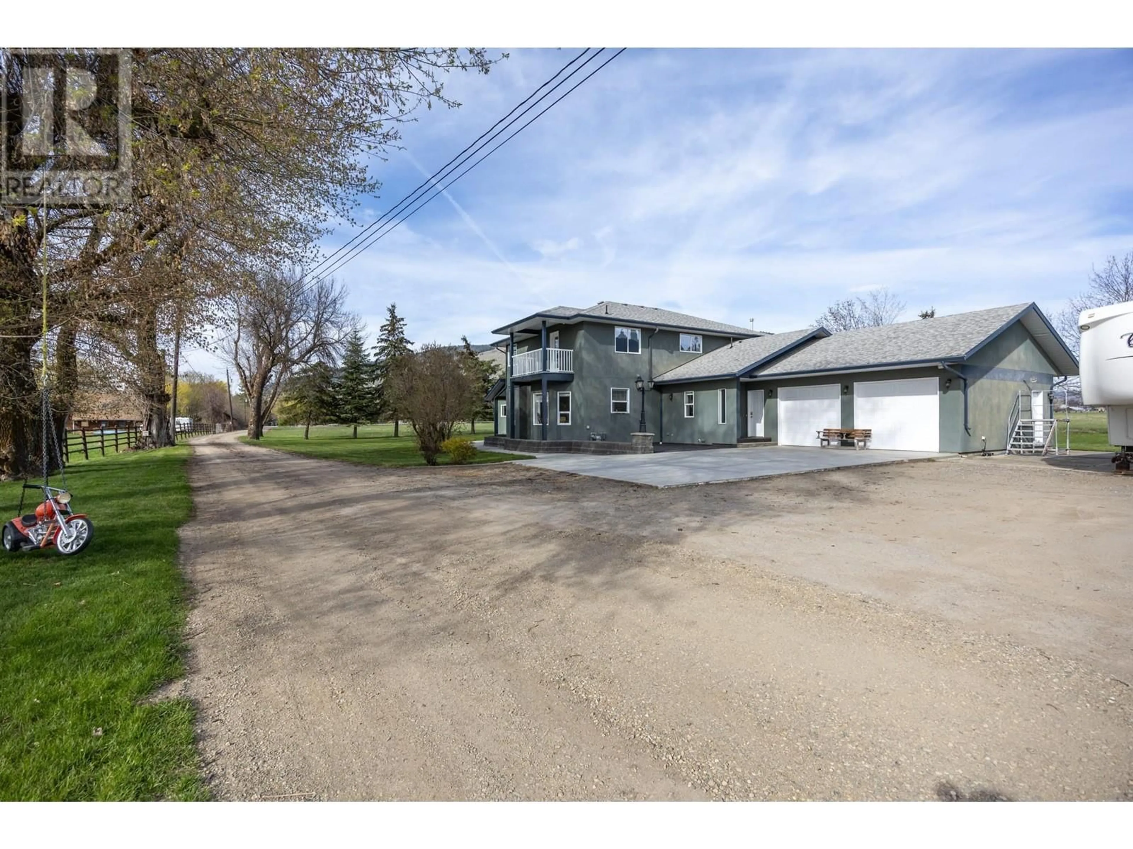 A pic from outside/outdoor area/front of a property/back of a property/a pic from drone, street for 9050 KALAMALKA ROAD, Coldstream British Columbia V1B3C3
