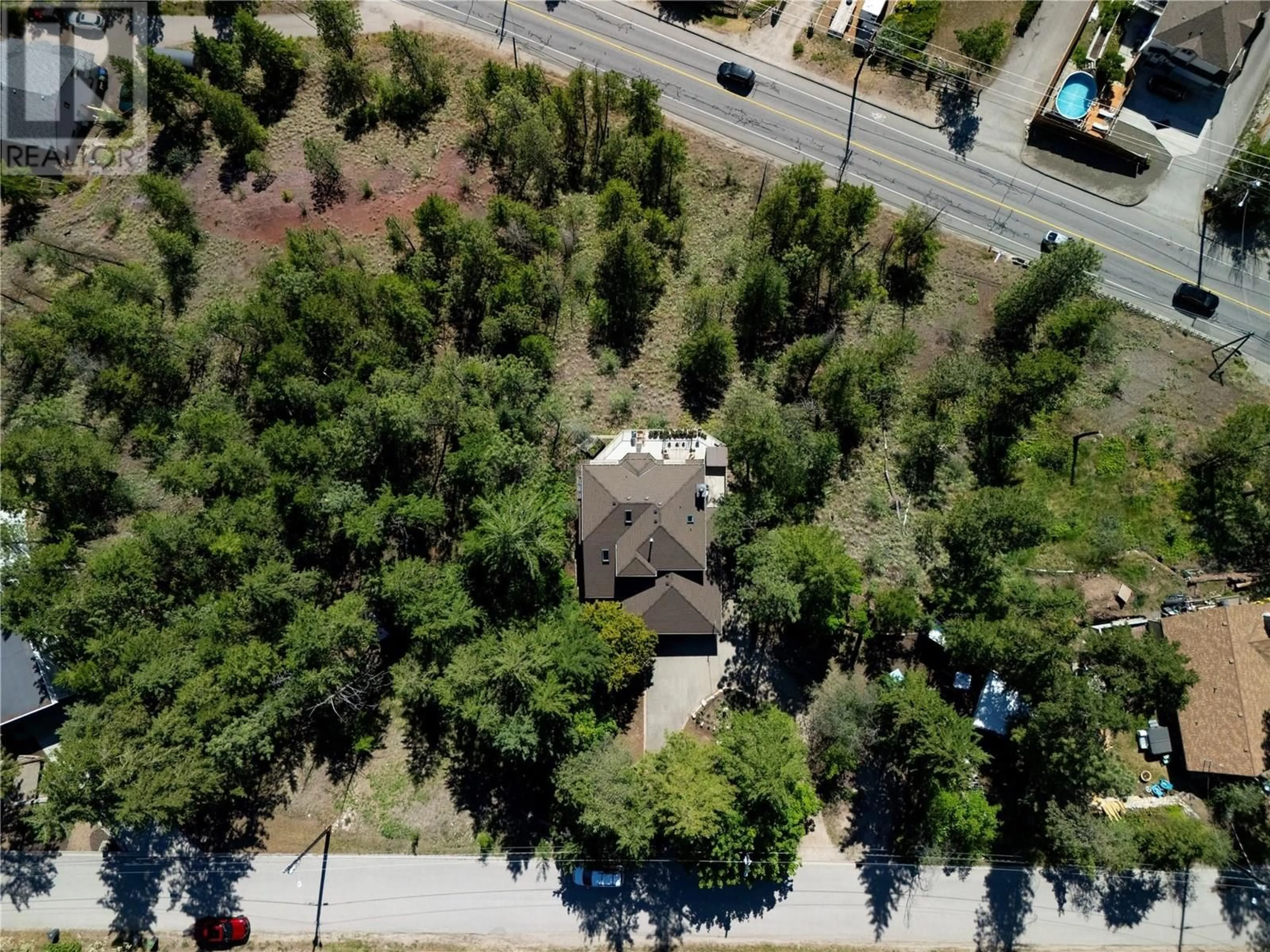 A pic from outside/outdoor area/front of a property/back of a property/a pic from drone, street for GRAINGER ROAD, Kelowna British Columbia V1V1C8
