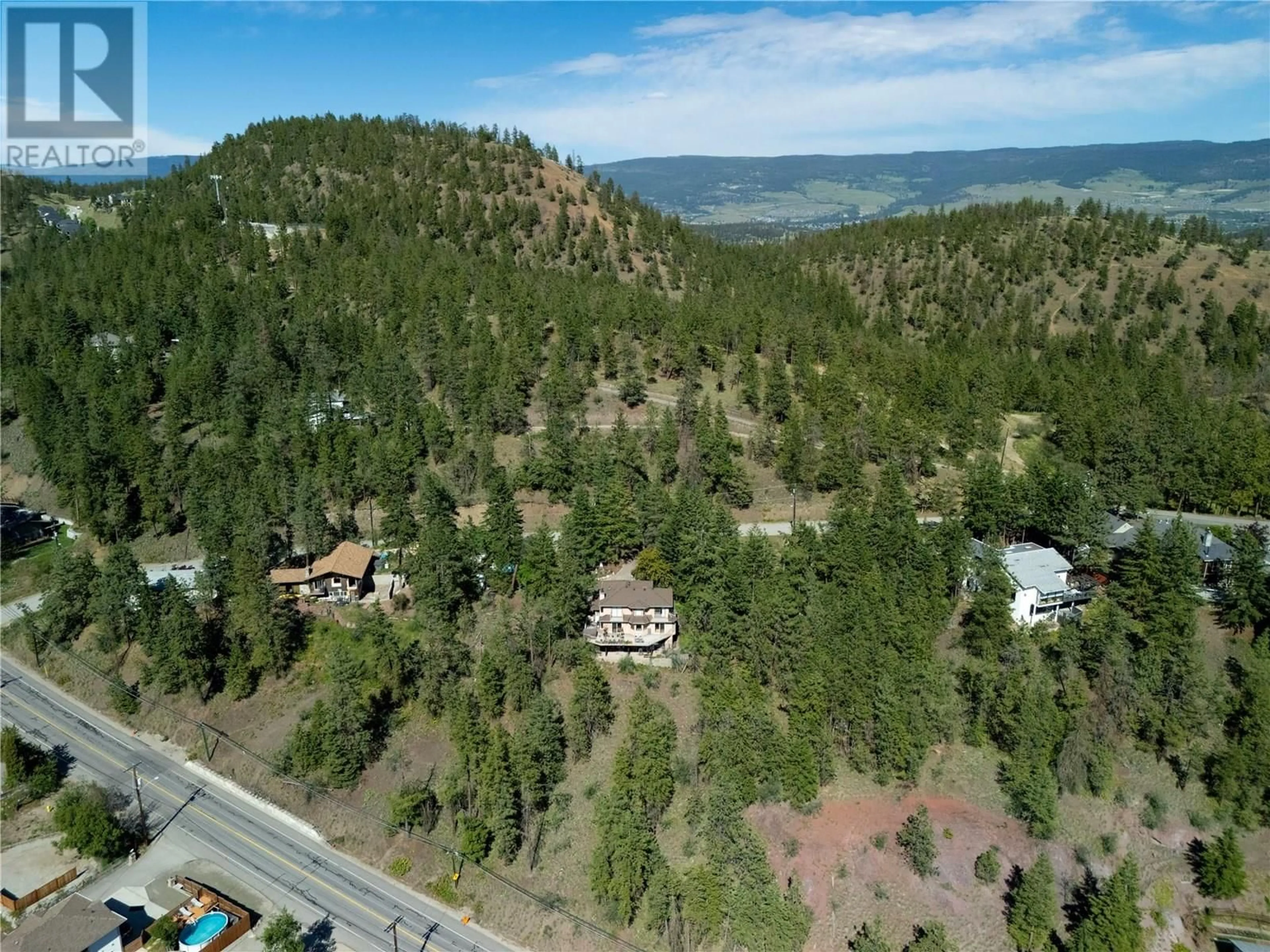 A pic from outside/outdoor area/front of a property/back of a property/a pic from drone, mountain view for GRAINGER ROAD, Kelowna British Columbia V1V1C8