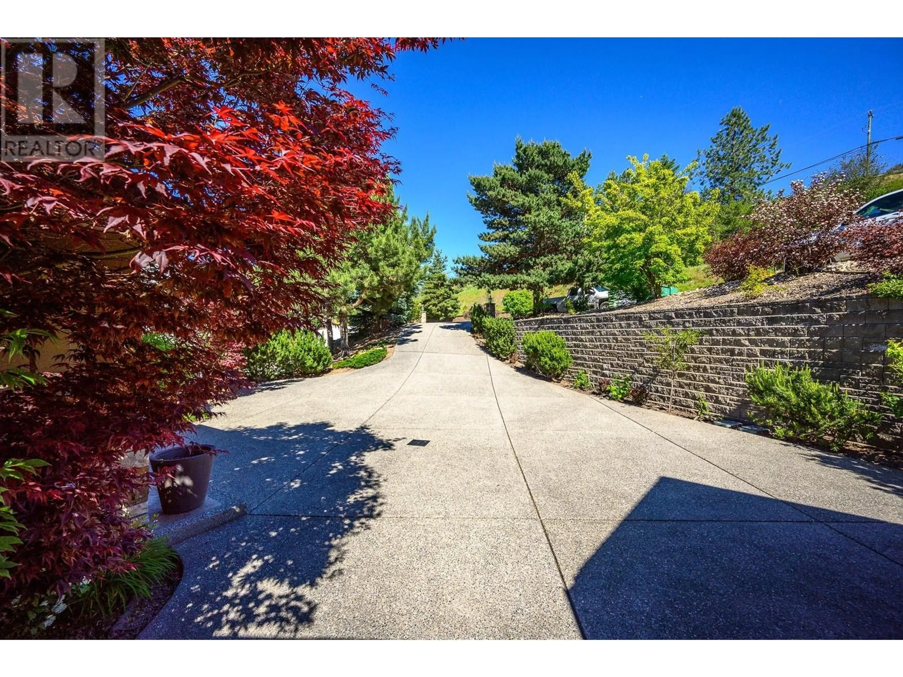 A pic from outside/outdoor area/front of a property/back of a property/a pic from drone, street for 5 - 12877 KIDSTON ROAD, Coldstream British Columbia V1B1Z4