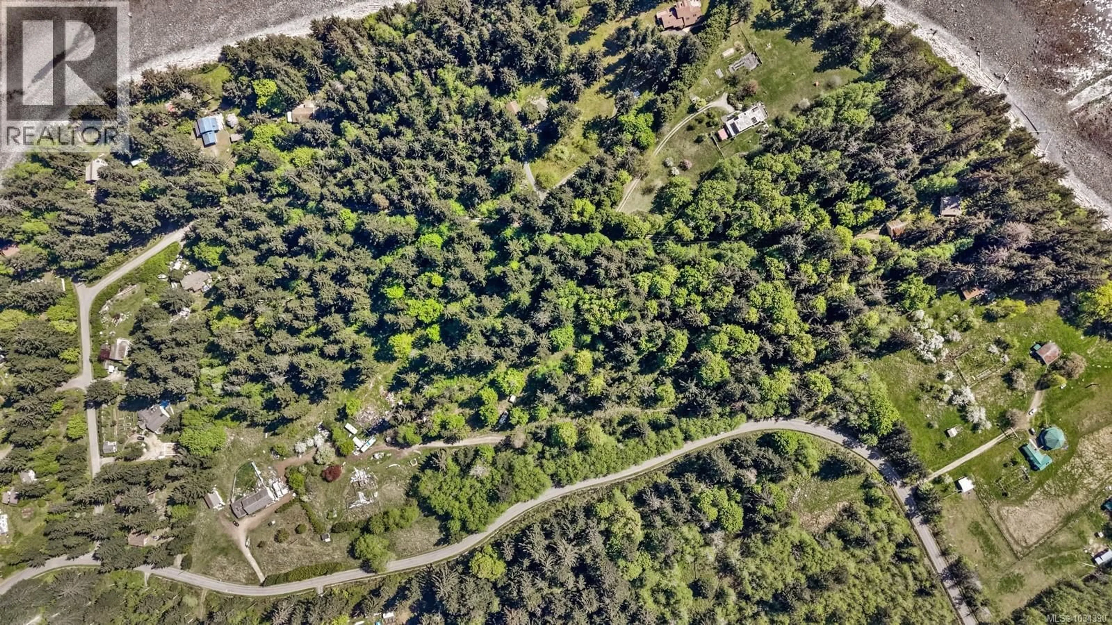 A pic from outside/outdoor area/front of a property/back of a property/a pic from drone, forest/trees view for 264 SUTIL ROAD, Quadra Island British Columbia V0P0A8