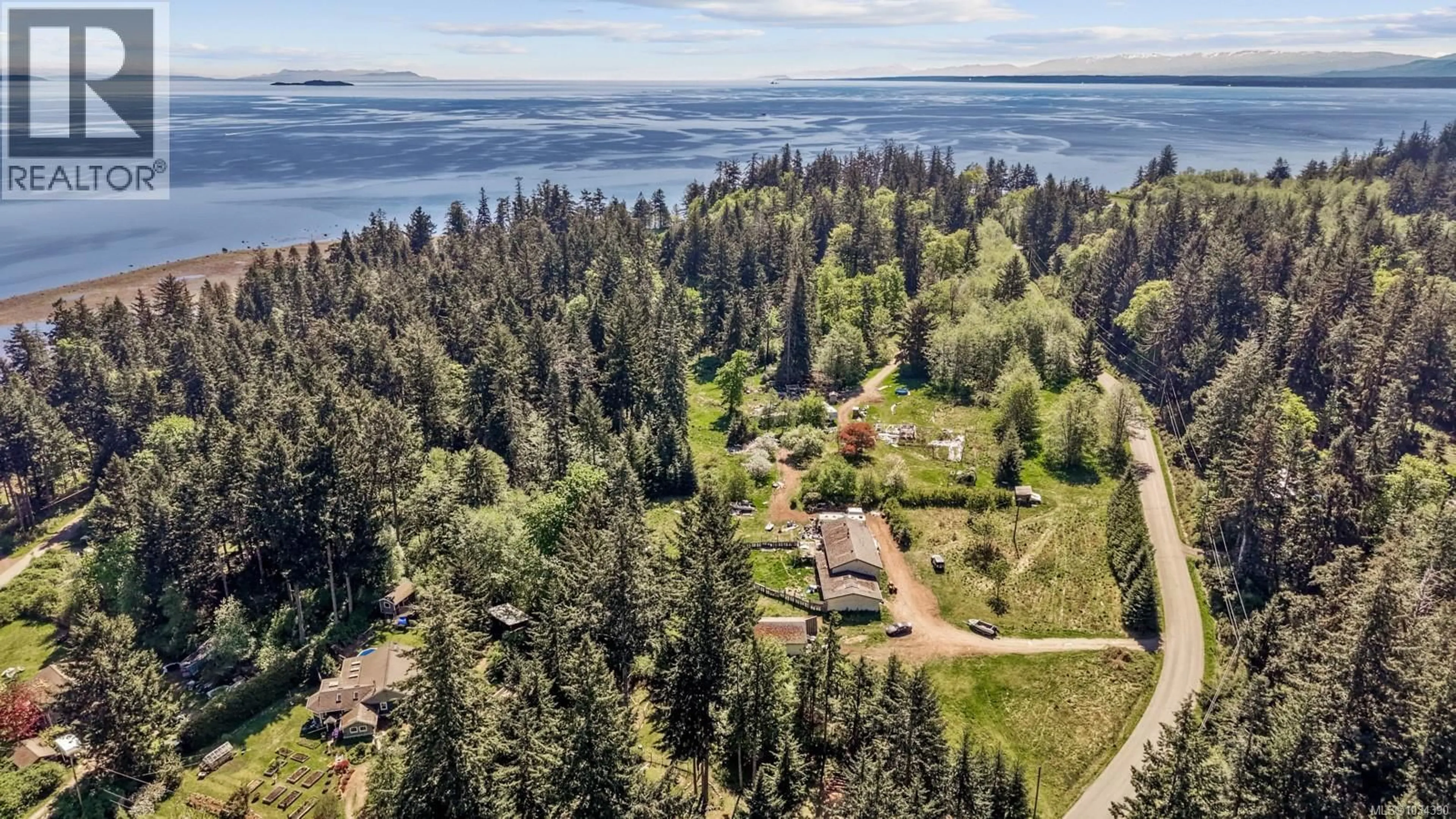 A pic from outside/outdoor area/front of a property/back of a property/a pic from drone, water/lake/river/ocean view for 264 SUTIL ROAD, Quadra Island British Columbia V0P0A8