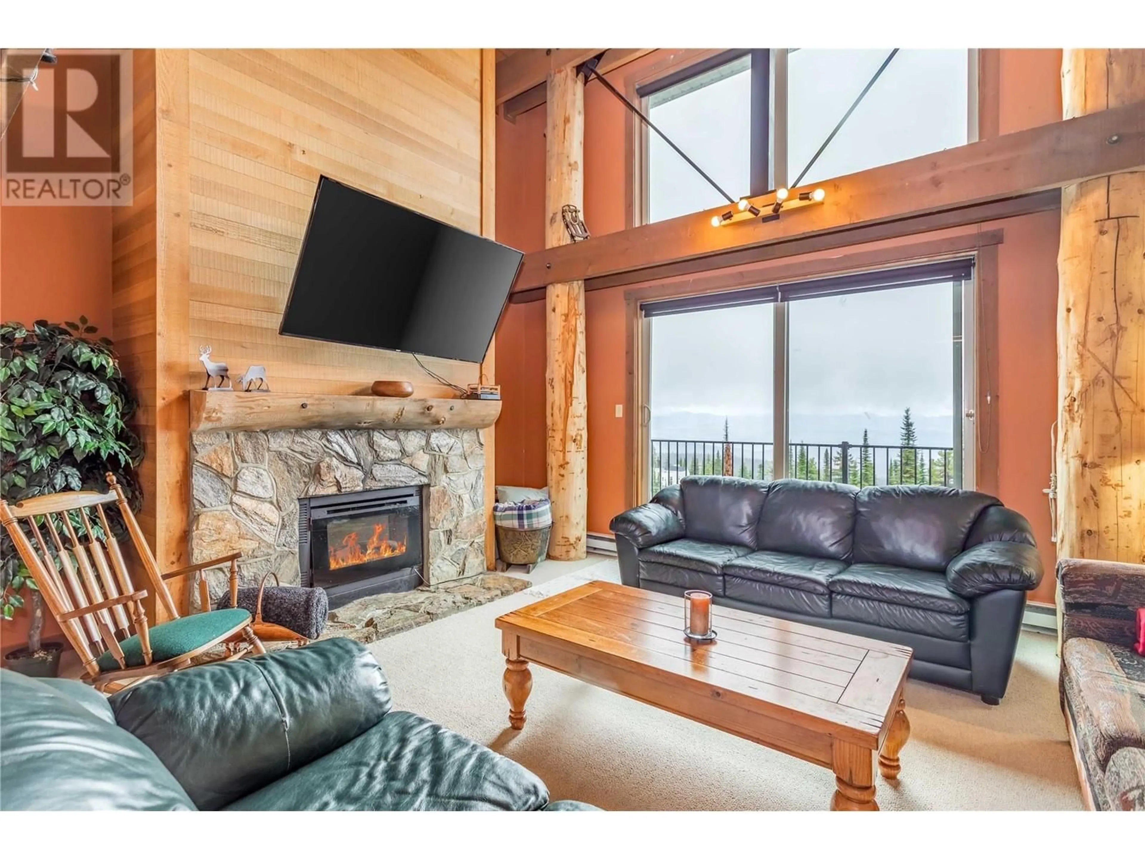 Living room with furniture, wood/laminate floor for 608 - 7470 PORCUPINE ROAD, Kelowna British Columbia V1X4K5
