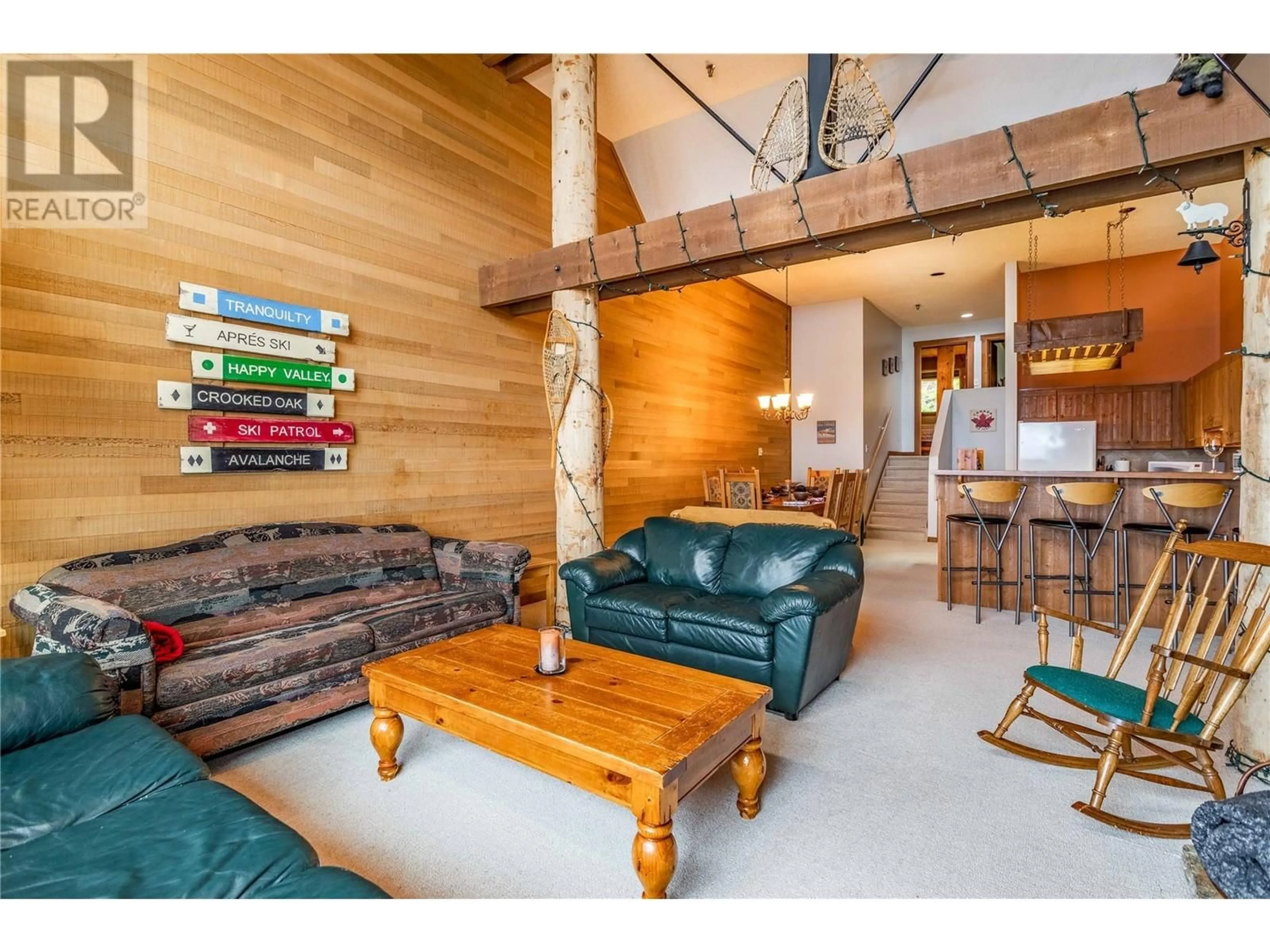 Living room with furniture, wood/laminate floor for 608 - 7470 PORCUPINE ROAD, Kelowna British Columbia V1X4K5