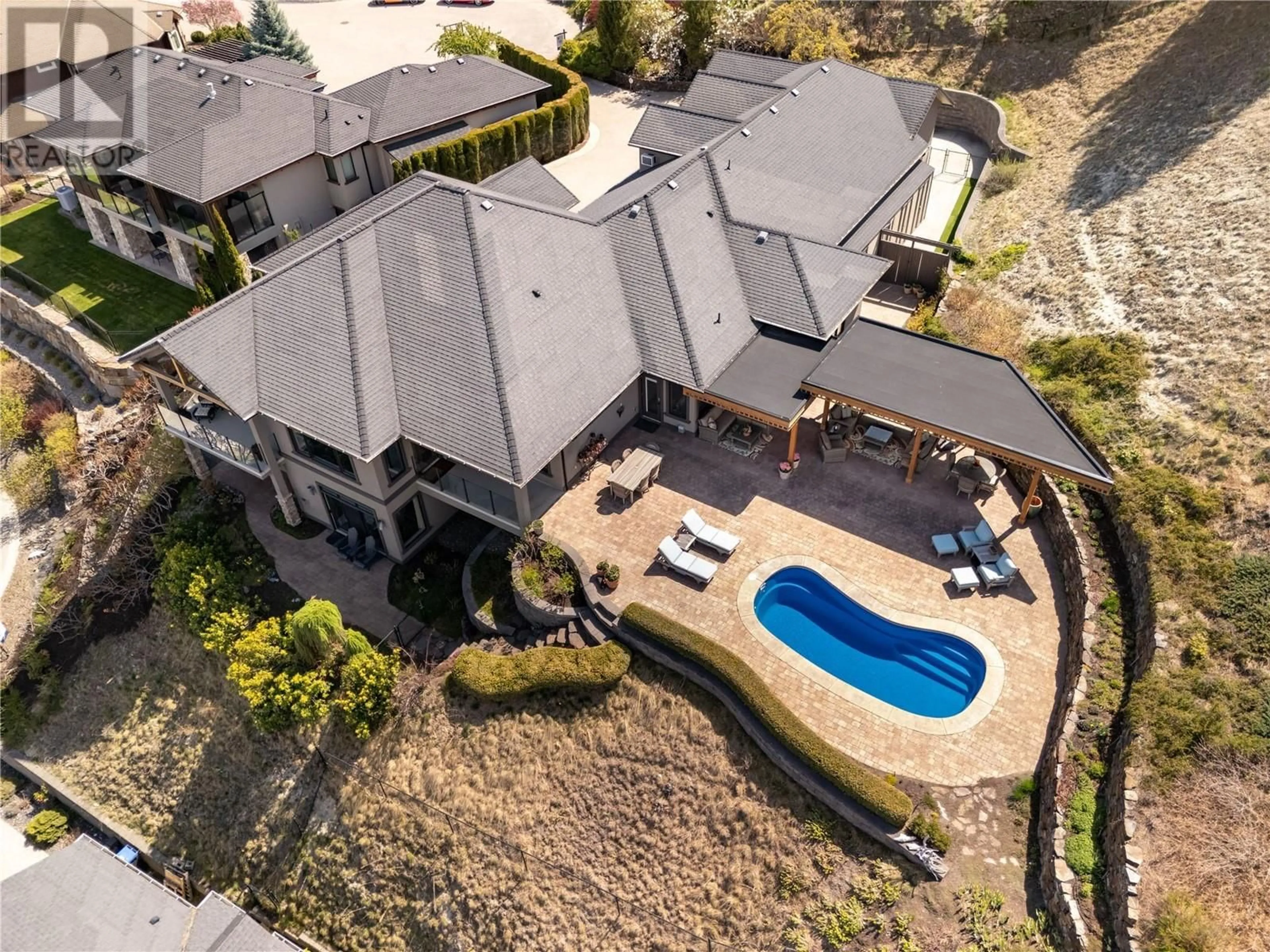 A pic from outside/outdoor area/front of a property/back of a property/a pic from drone, street for 605 ALMANDINE COURT, Kelowna British Columbia V1W4Z5