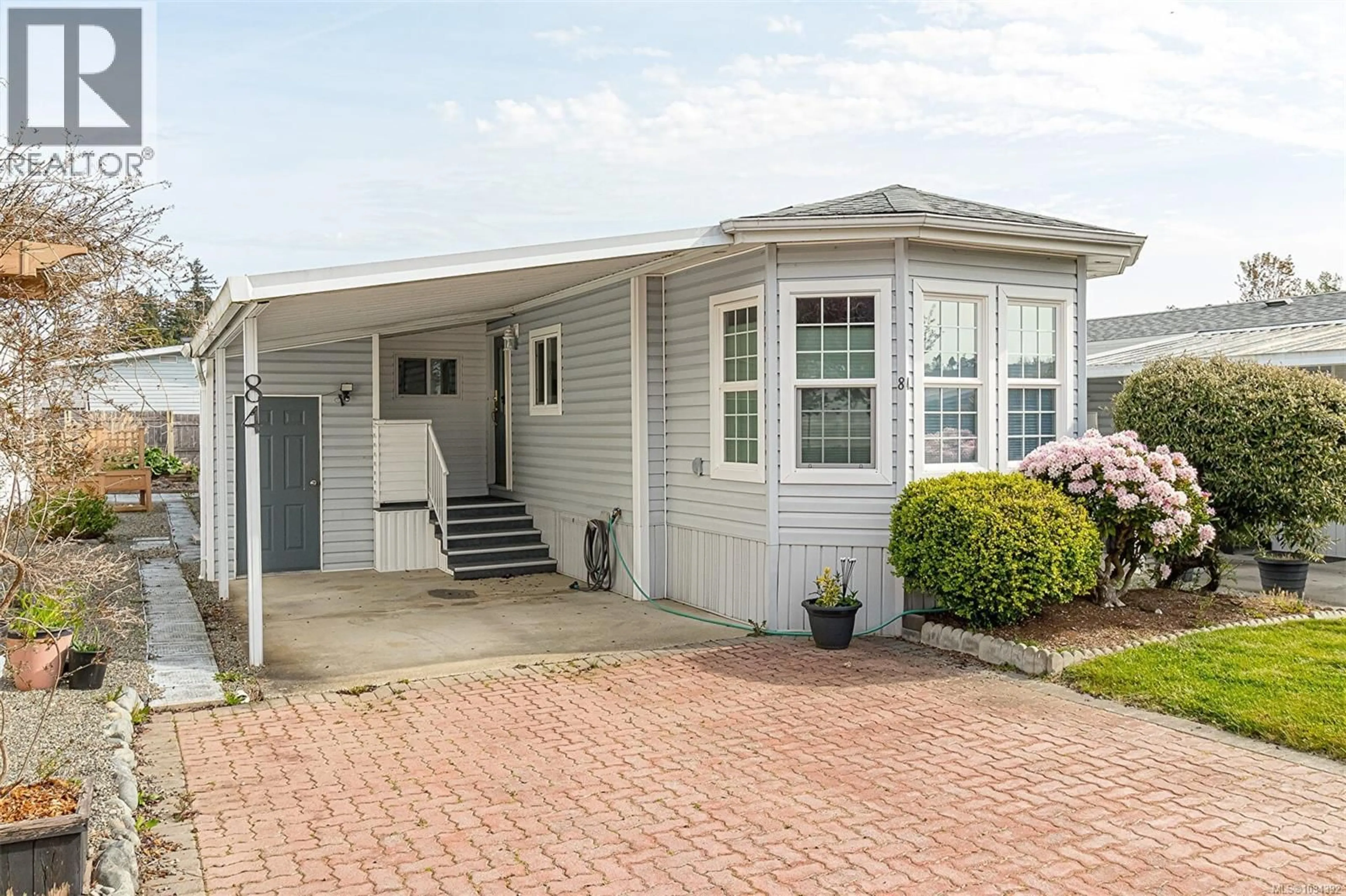 Home with vinyl exterior material, street for 84 - 7583 CENTRAL SAANICH ROAD, Central Saanich British Columbia V8M2B6