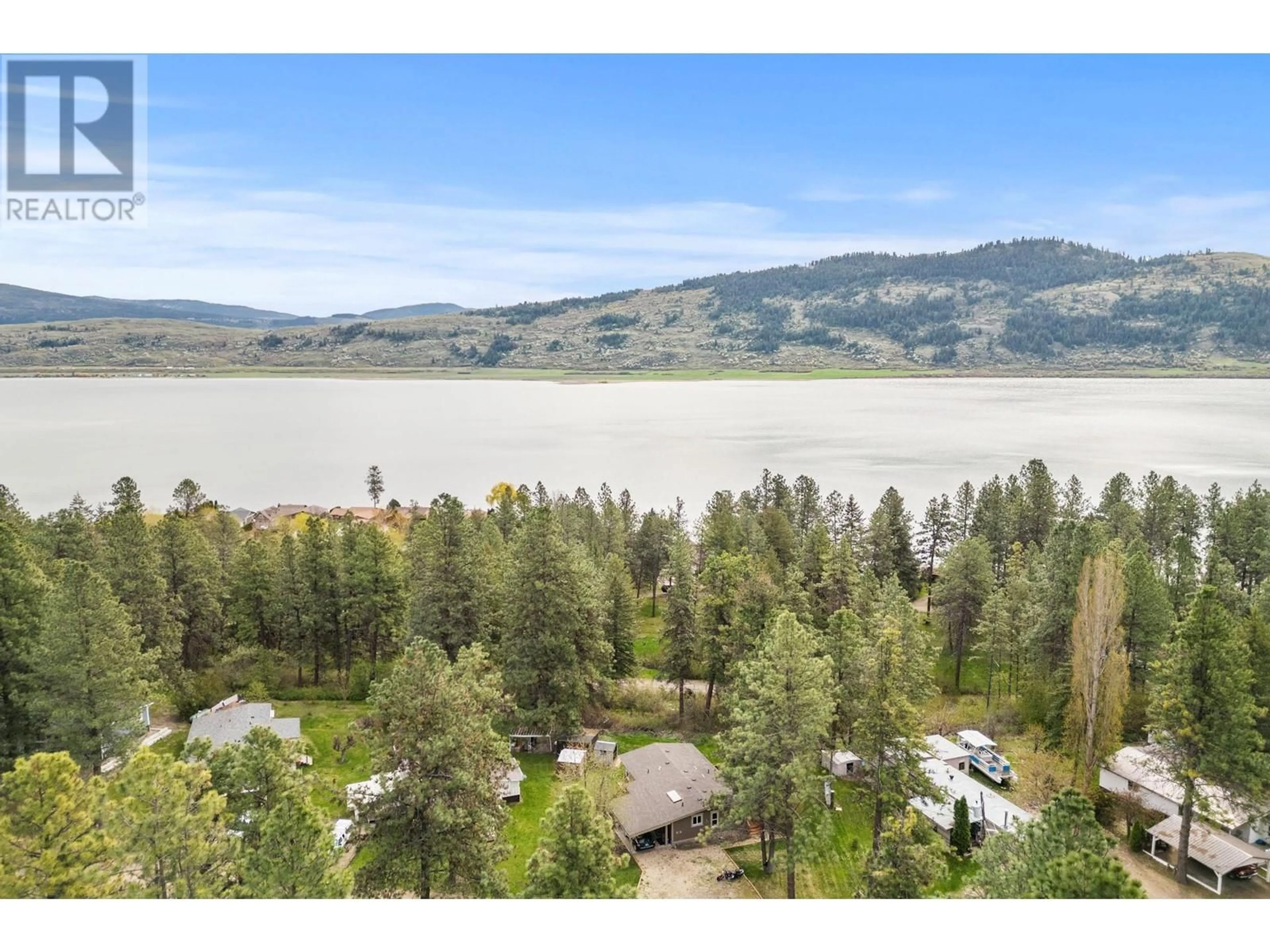 A pic from outside/outdoor area/front of a property/back of a property/a pic from drone, water/lake/river/ocean view for 4 - 12069 WESTSIDE ROAD, Vernon British Columbia V1H2A5