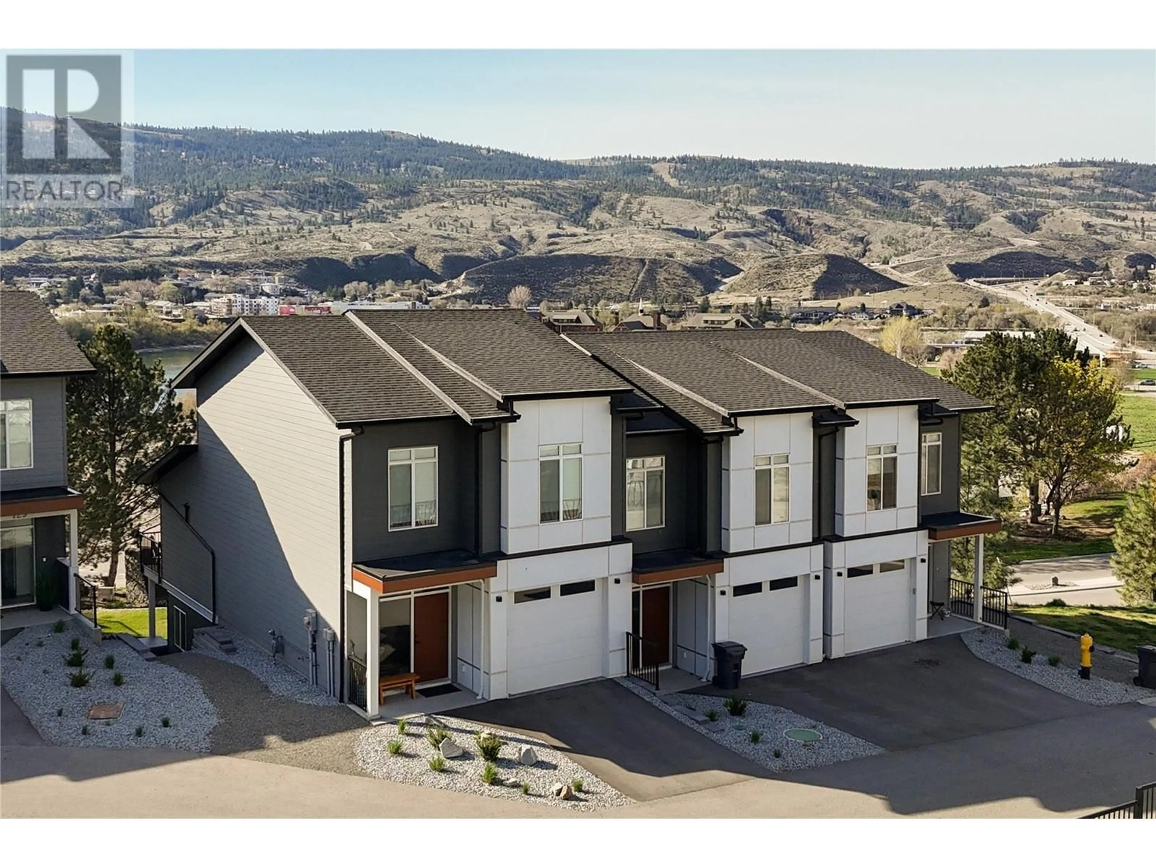 A pic from outside/outdoor area/front of a property/back of a property/a pic from drone, mountain view for 130 RIVER GATE DRIVE, Kamloops British Columbia V2H0E4