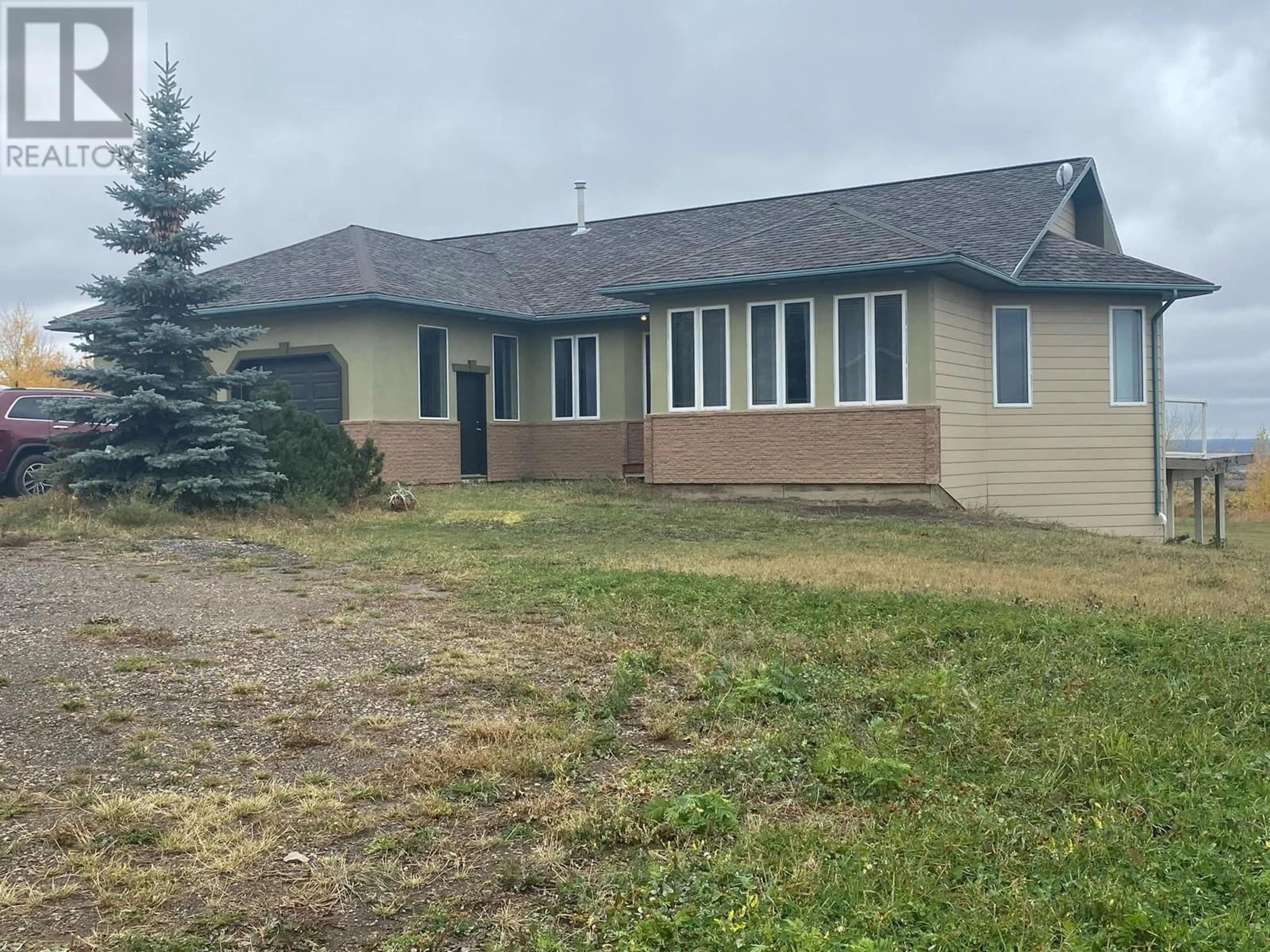 A pic from outside/outdoor area/front of a property/back of a property/a pic from drone, building for 13335 TRAIL WAY OTHER, Dawson Creek British Columbia V1G0H3