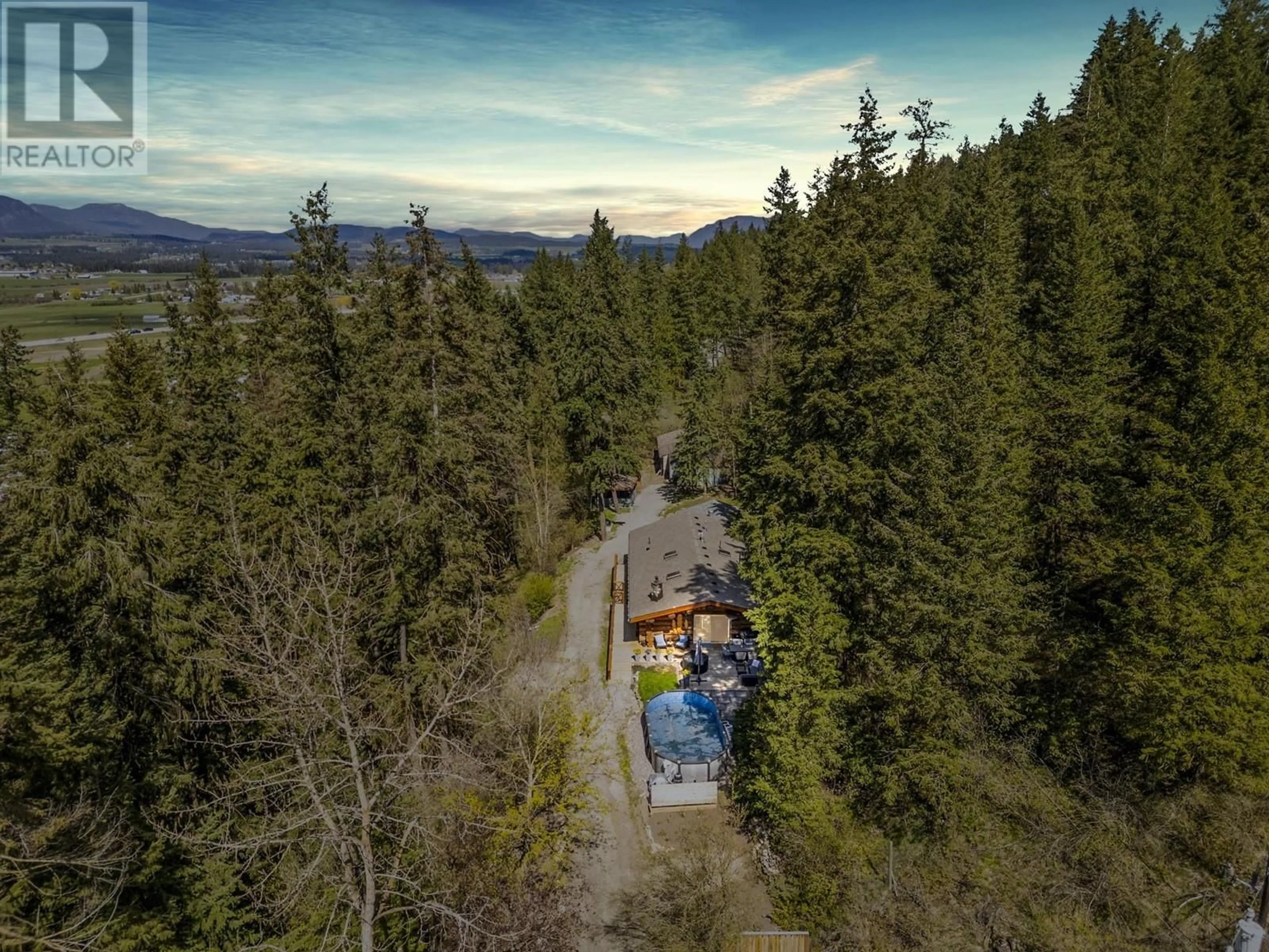 A pic from outside/outdoor area/front of a property/back of a property/a pic from drone, forest/trees view for 1645 SIMONS ROAD, Spallumcheen British Columbia V4Y0R4