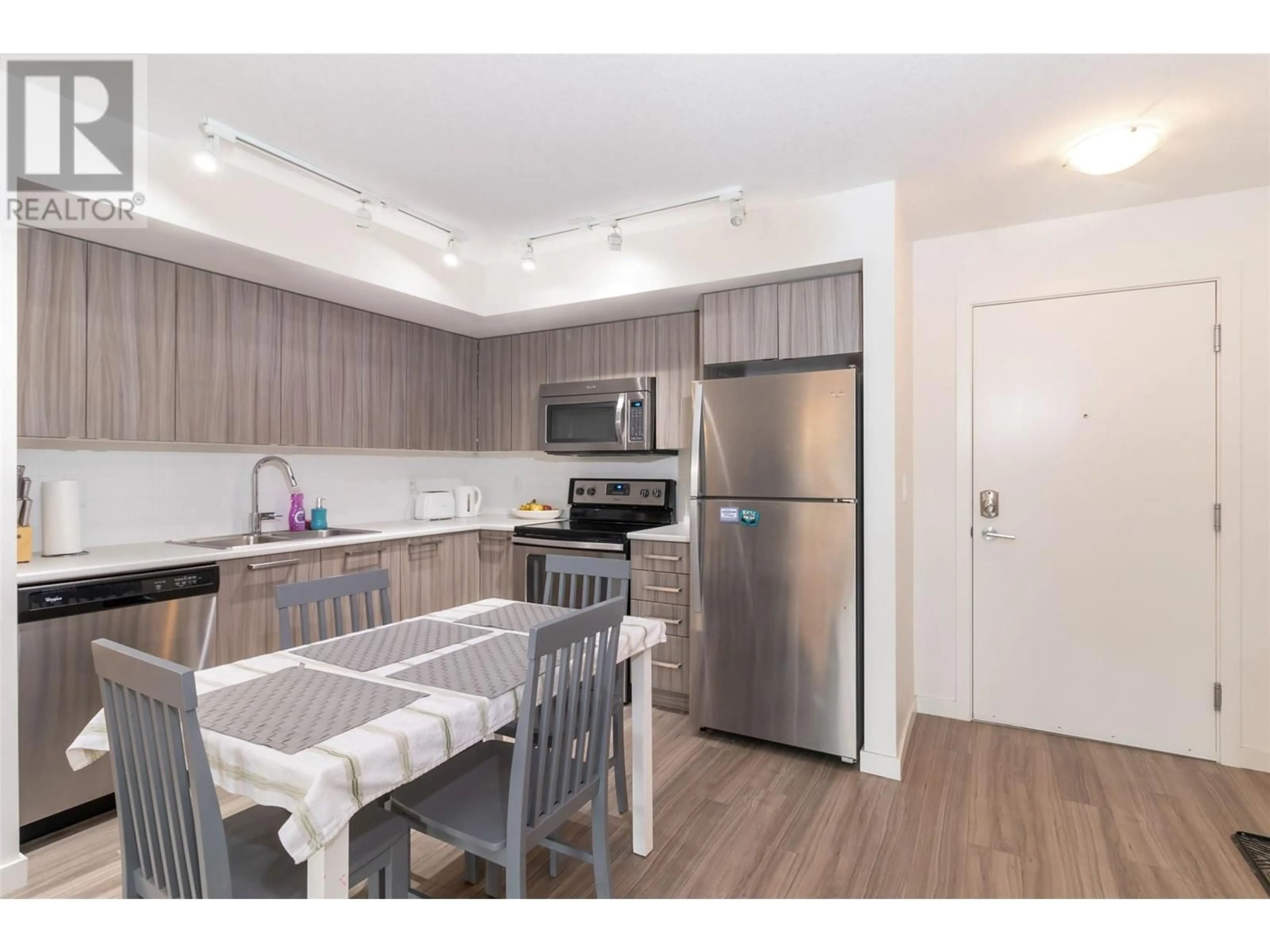 Standard kitchen, wood/laminate floor for 210 - 881 ACADEMY WAY, Kelowna British Columbia V1V0A2