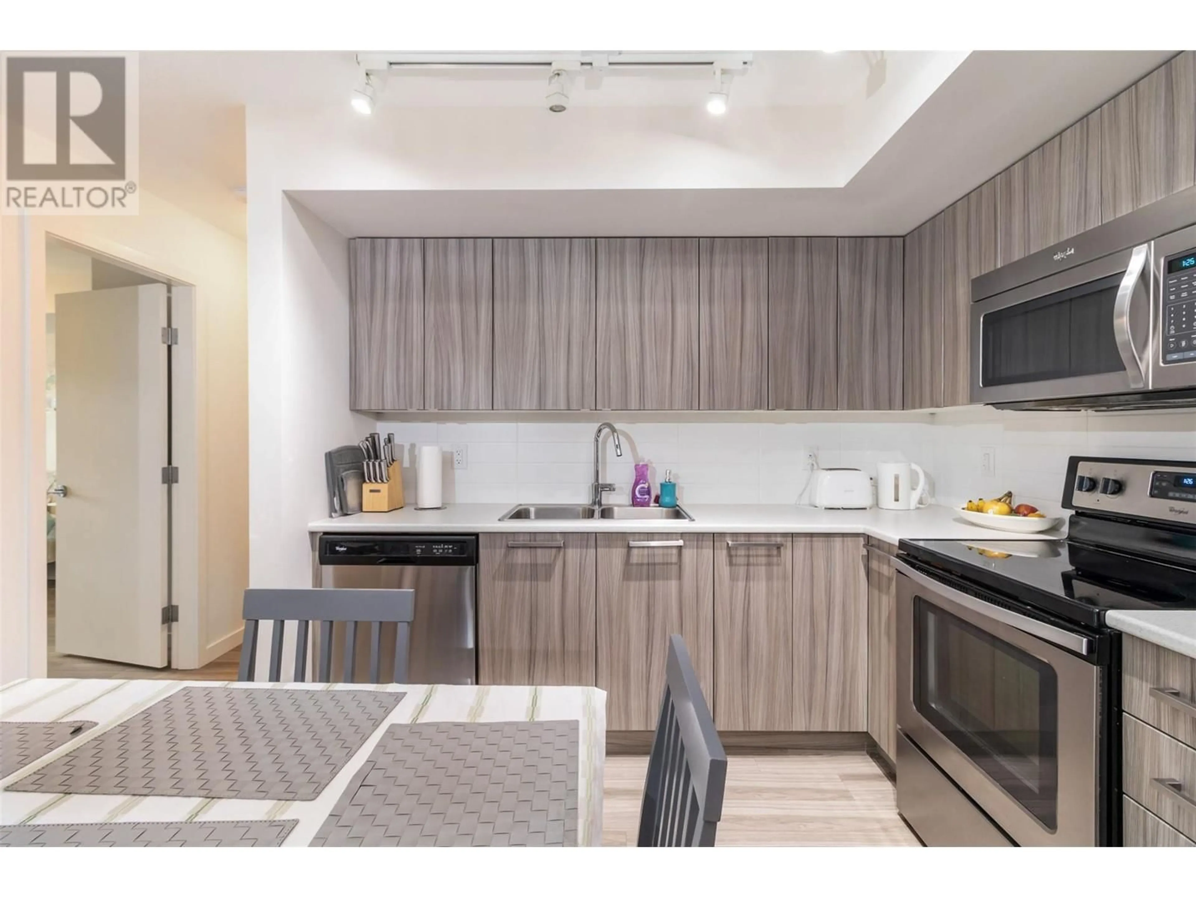 Open concept kitchen, unknown for 210 - 881 ACADEMY WAY, Kelowna British Columbia V1V0A2