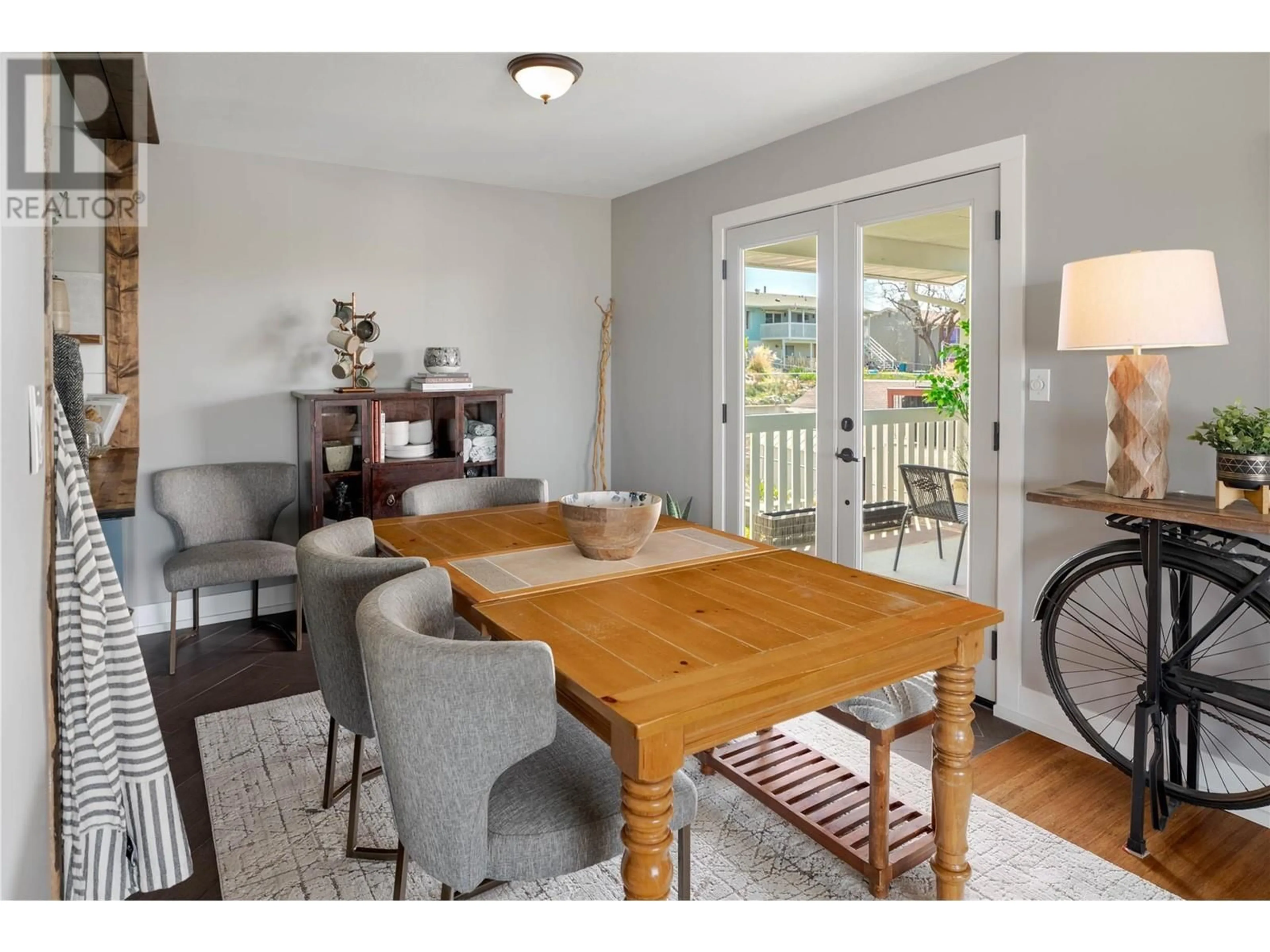 Living room with furniture, wood/laminate floor for 1815 JONATHAN ROAD, Kelowna British Columbia V1P1A9