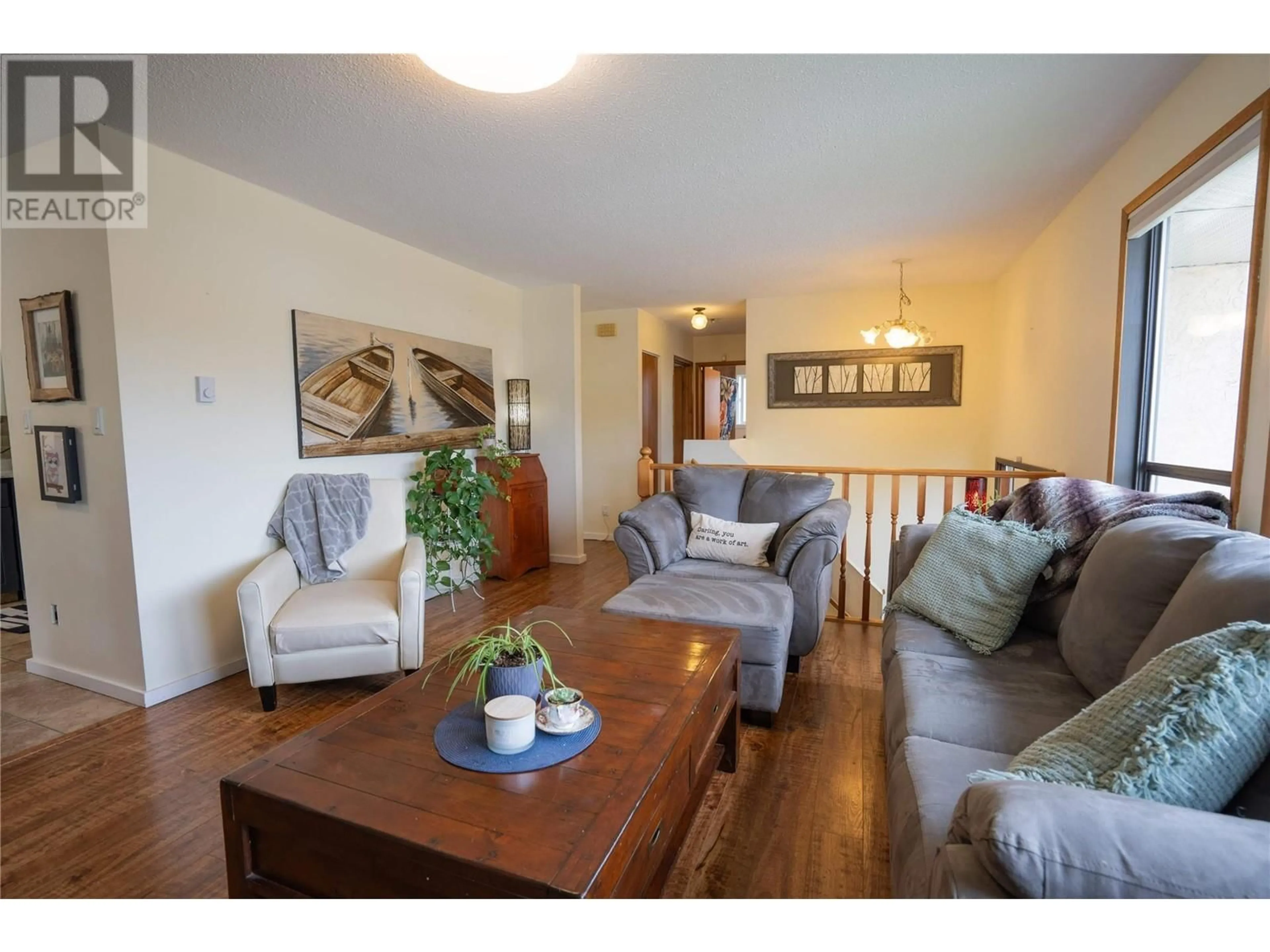 Living room with furniture, wood/laminate floor for 164 PHOENIX AVENUE, Penticton British Columbia V2A2Z5