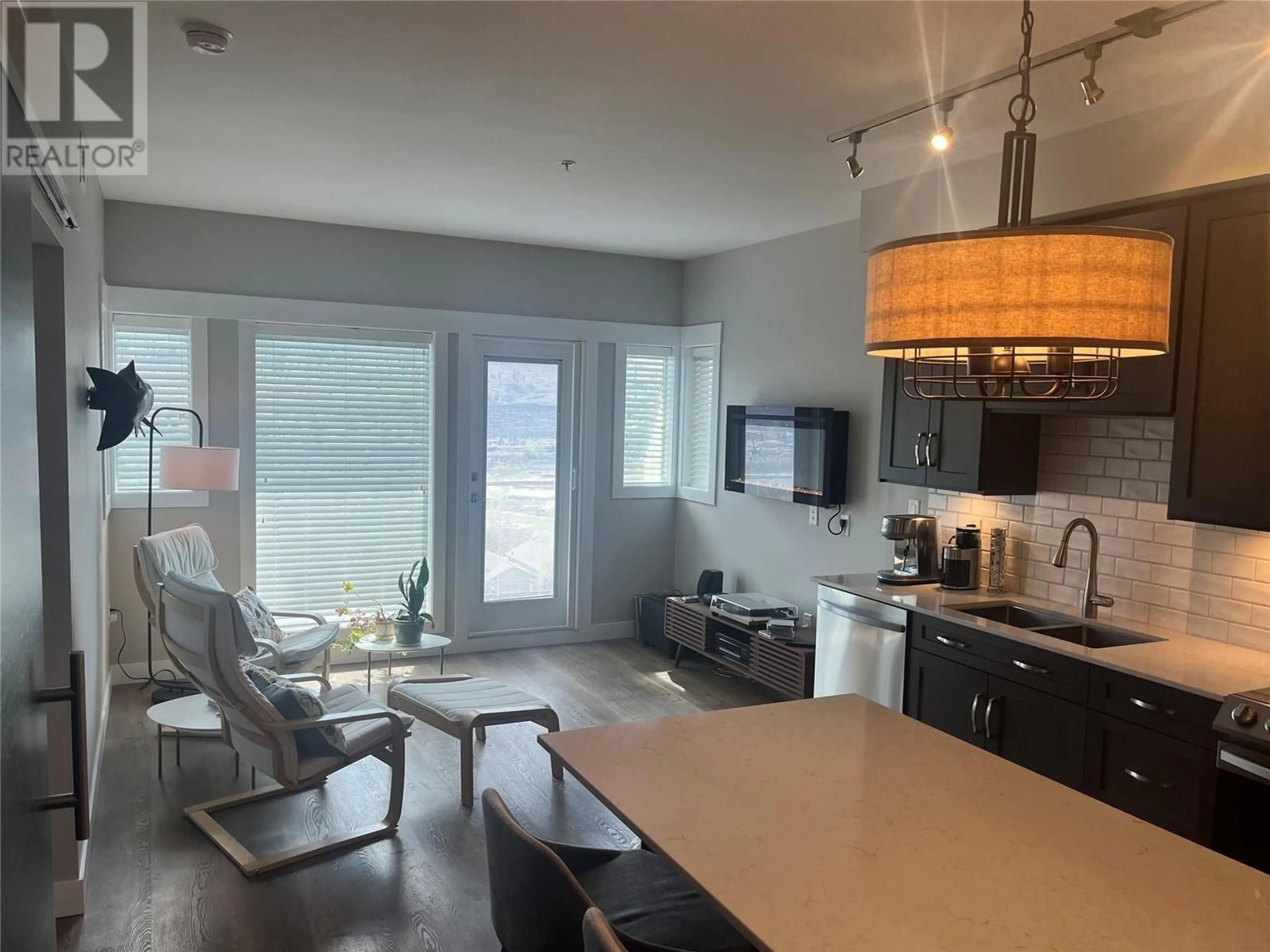 Open concept kitchen, wood/laminate floor for 2315 - 1030 TALASA WAY, Kamloops British Columbia V2H1R1