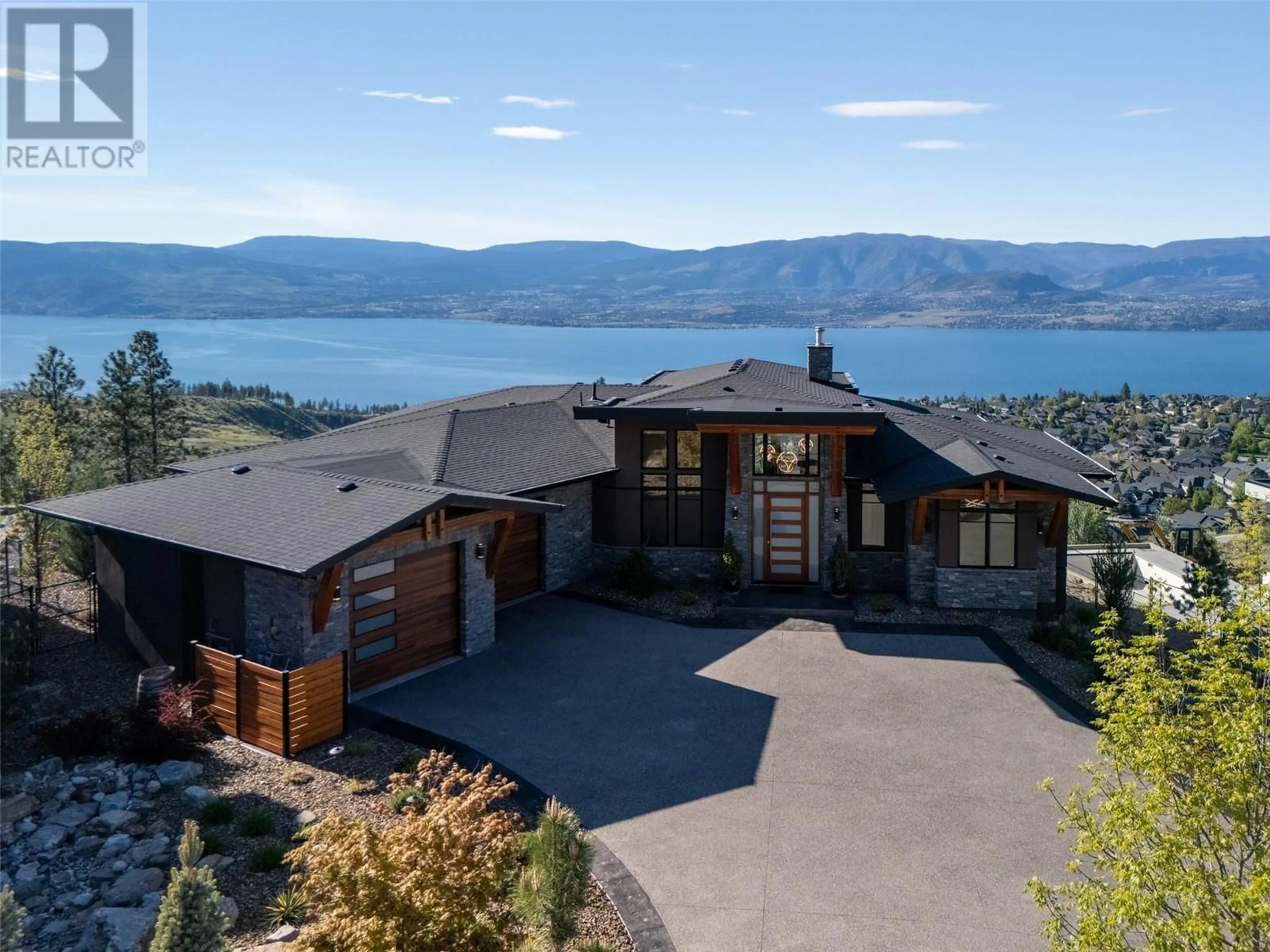 A pic from outside/outdoor area/front of a property/back of a property/a pic from drone, water/lake/river/ocean view for 105 - 5650 THE EDGE PLACE, Kelowna British Columbia V1W5M4