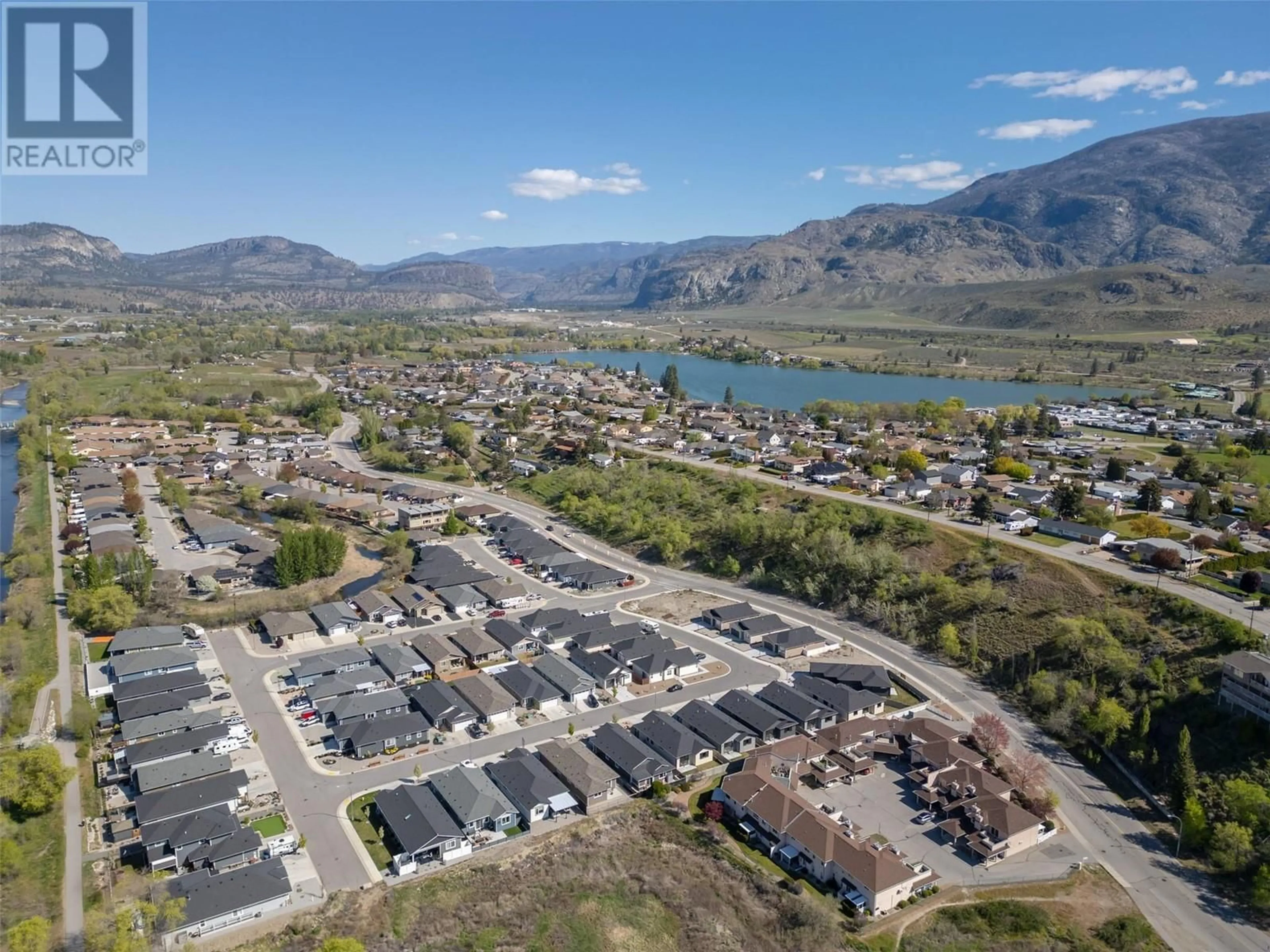 A pic from outside/outdoor area/front of a property/back of a property/a pic from drone, mountain view for 261 BENTGRASS AVENUE, Oliver British Columbia V0H1T3