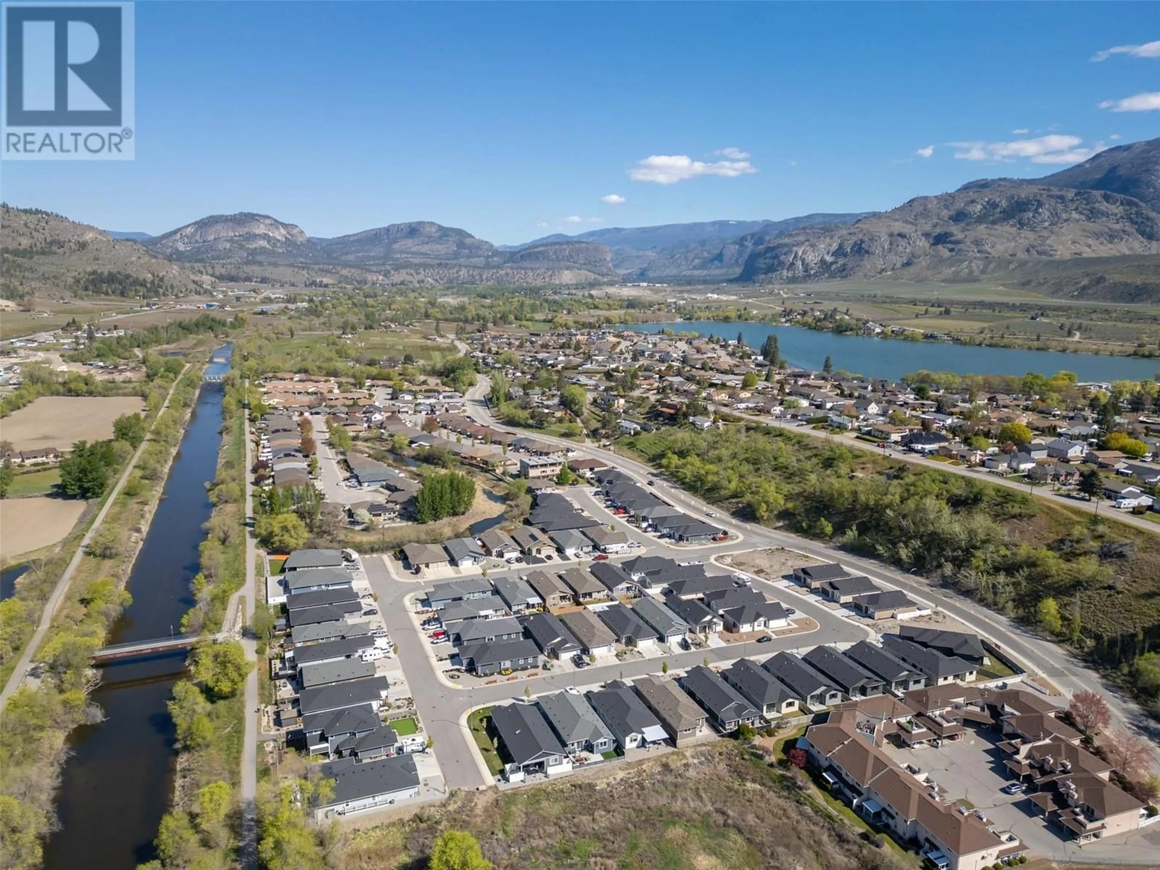 A pic from outside/outdoor area/front of a property/back of a property/a pic from drone, water/lake/river/ocean view for 261 BENTGRASS AVENUE, Oliver British Columbia V0H1T3