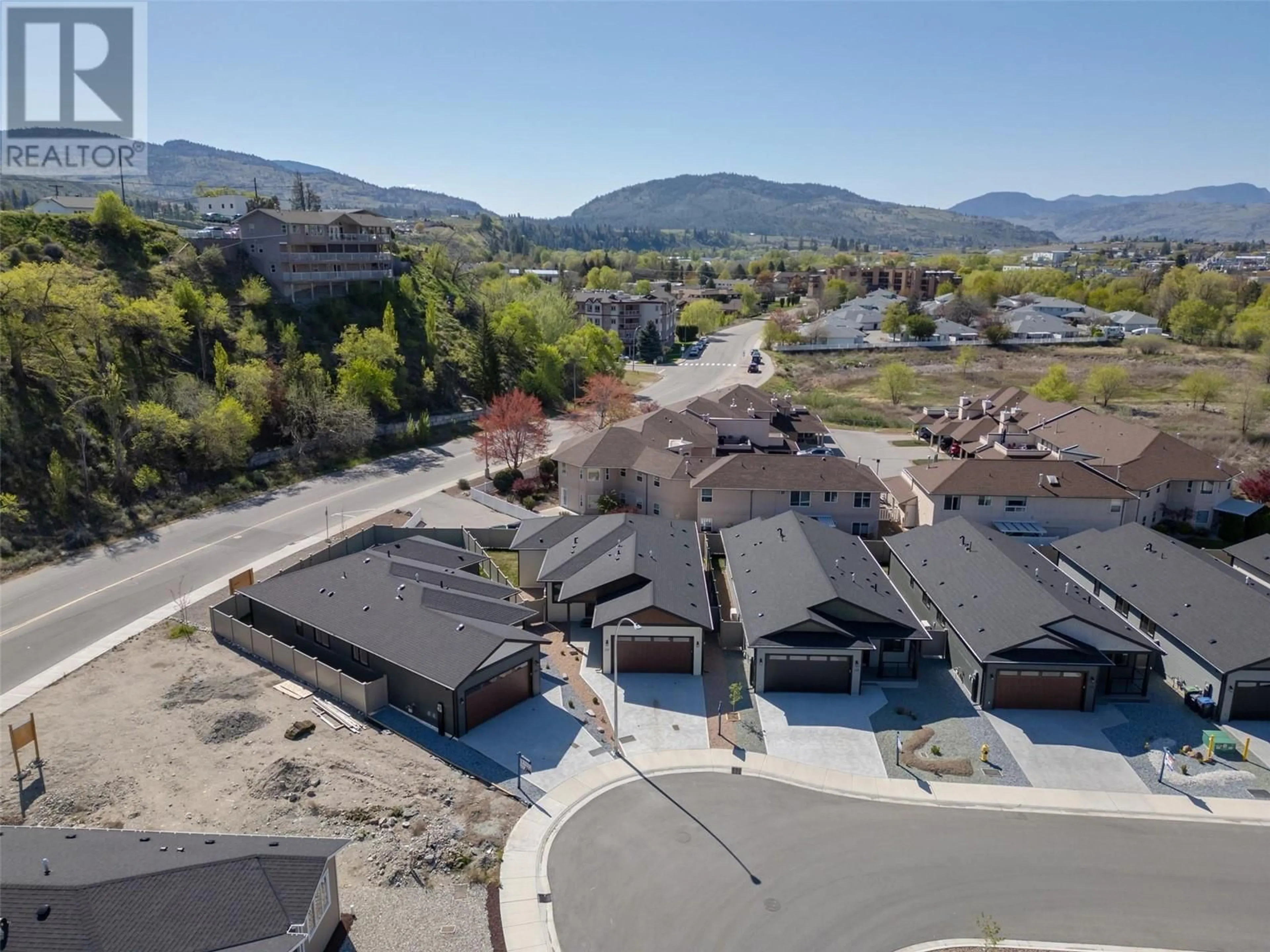 A pic from outside/outdoor area/front of a property/back of a property/a pic from drone, mountain view for 261 BENTGRASS AVENUE, Oliver British Columbia V0H1T3